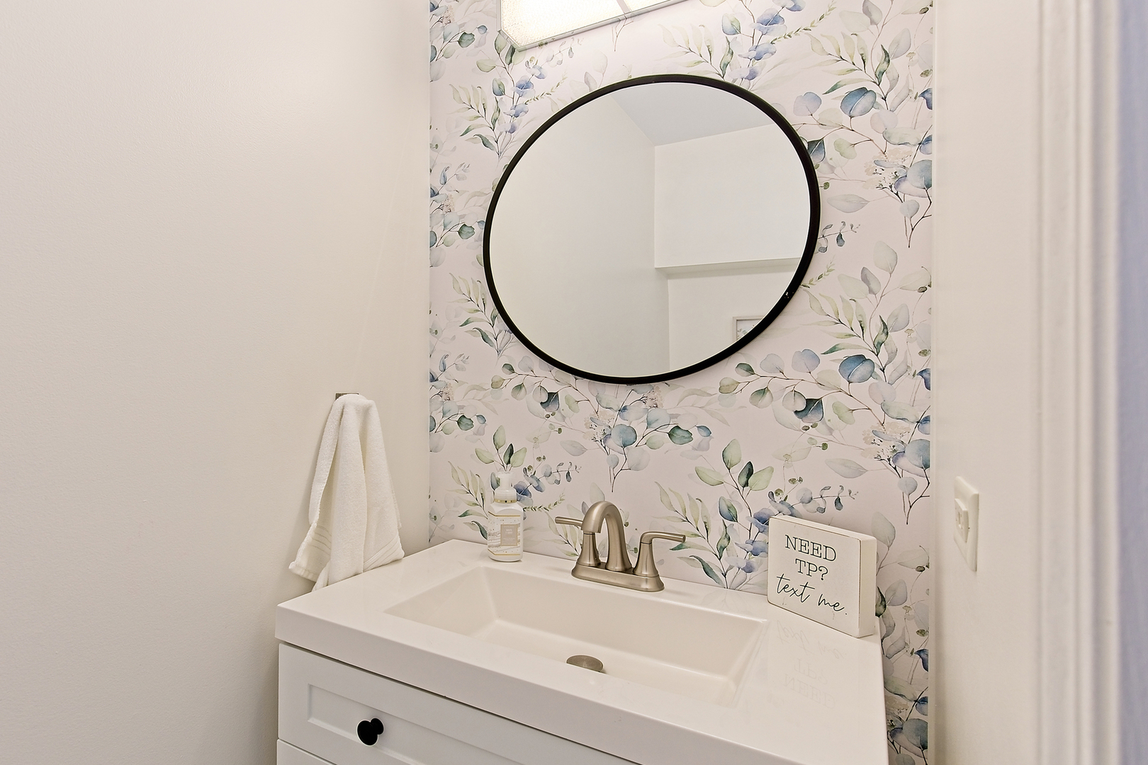 34318 North Barberry Road Round Lake Beach, IL 60073 - Photo 14 of 26 a bathroom with a sink and a mirror