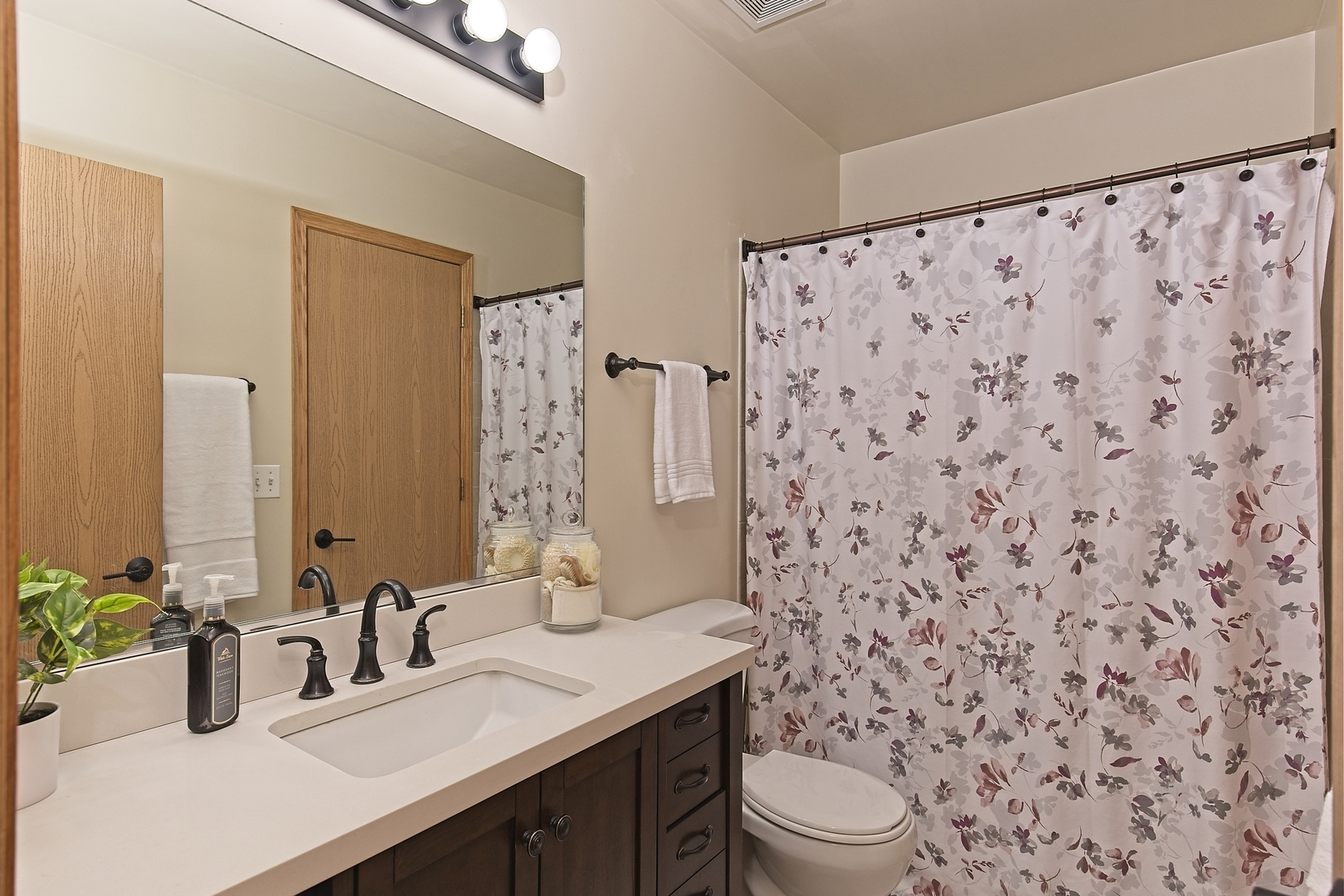 34318 North Barberry Road Round Lake Beach, IL 60073 - Photo 17 of 26 a bathroom with a granite countertop sink a toilet and a mirror