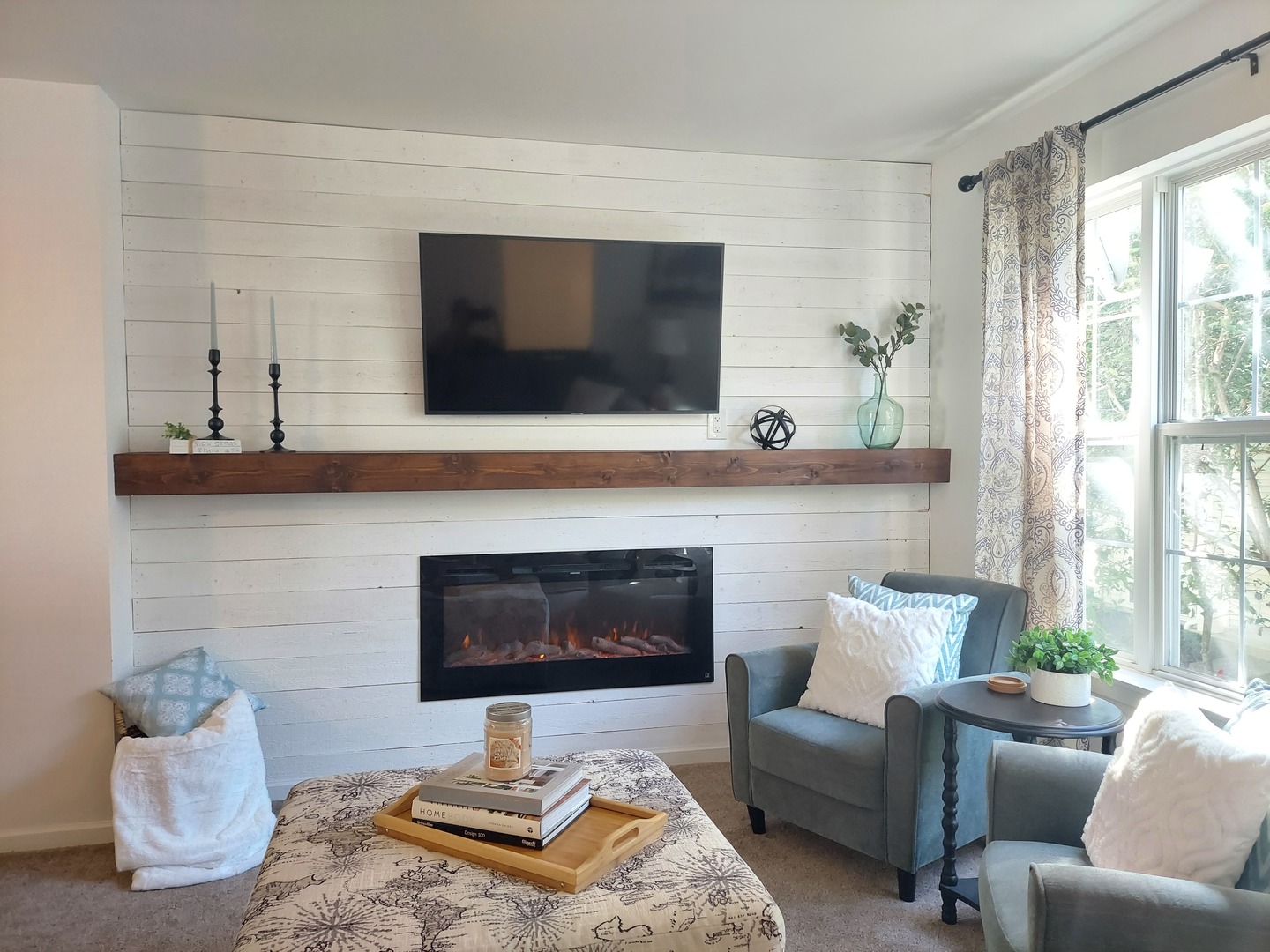 34318 North Barberry Road Round Lake Beach, IL 60073 - Photo 22 of 26 a living room with furniture a flat screen tv and a fireplace