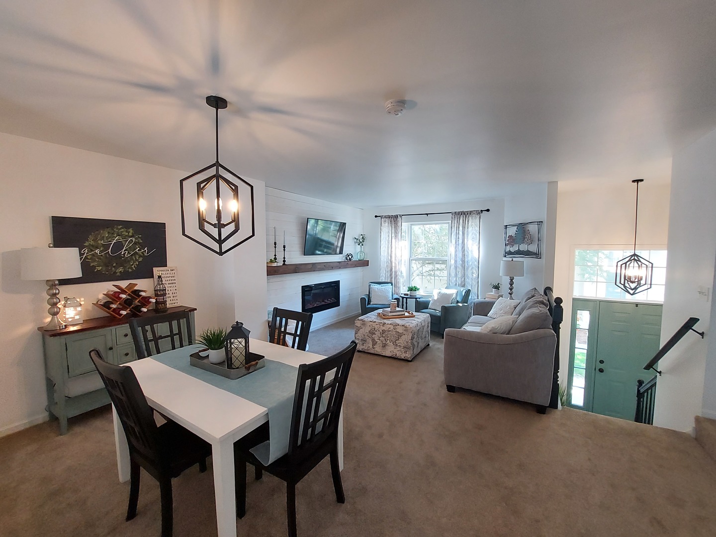 34318 North Barberry Road Round Lake Beach, IL 60073 - Photo 23 of 26 a view of a dining room with furniture a chandelier and wooden floor
