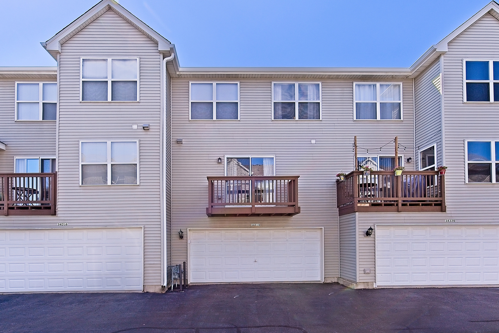 34318 North Barberry Road Round Lake Beach, IL 60073 - Photo 26 of 26 a view of a house with entryway and a yard