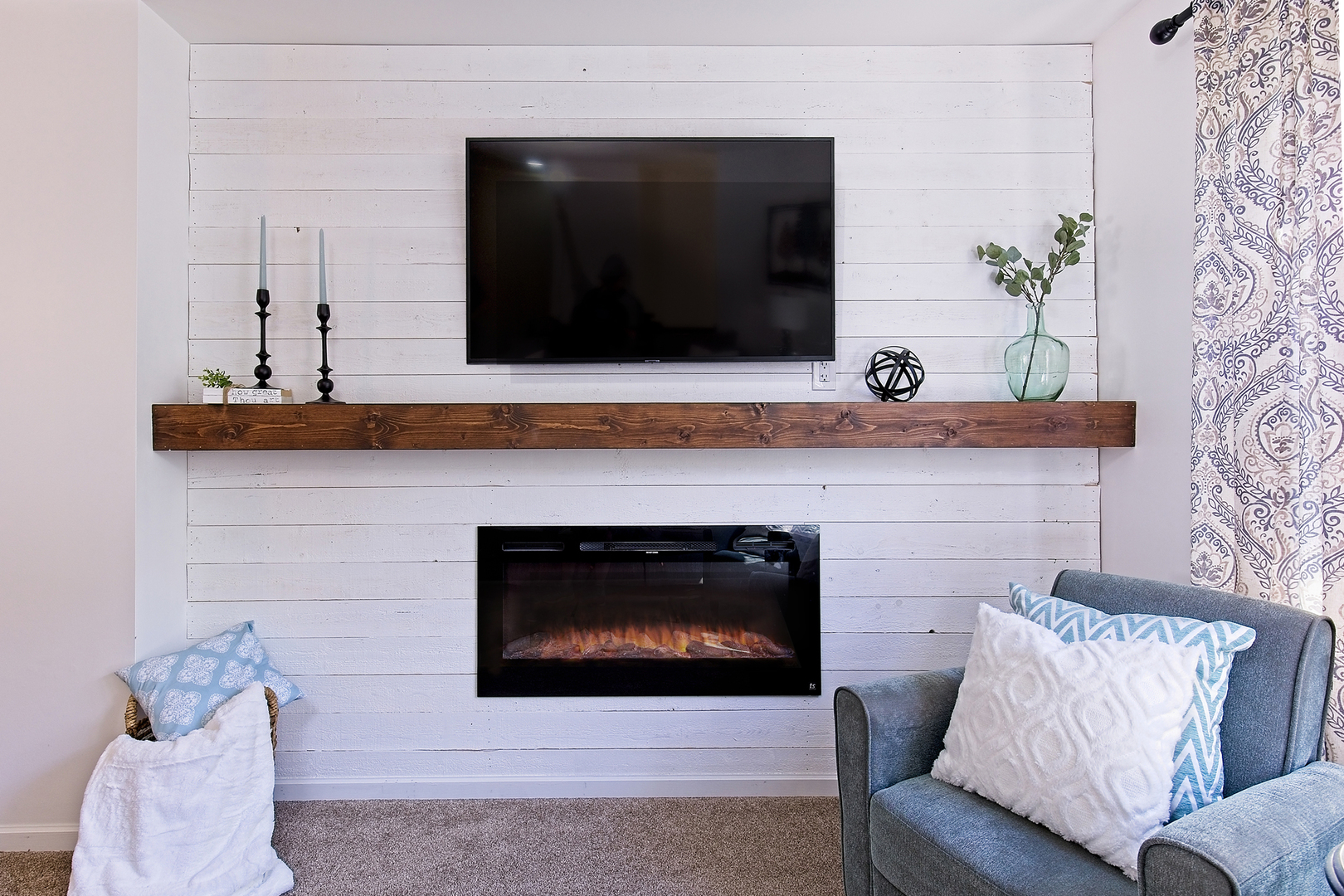 34318 North Barberry Road Round Lake Beach, IL 60073 - Photo 5 of 26 a living room with a fireplace and a potted plant