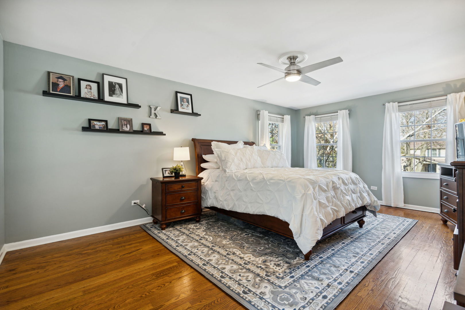 1246 Edward Road Naperville, IL 60540 - Photo 12 of 21 a spacious bedroom with a bed and a couch