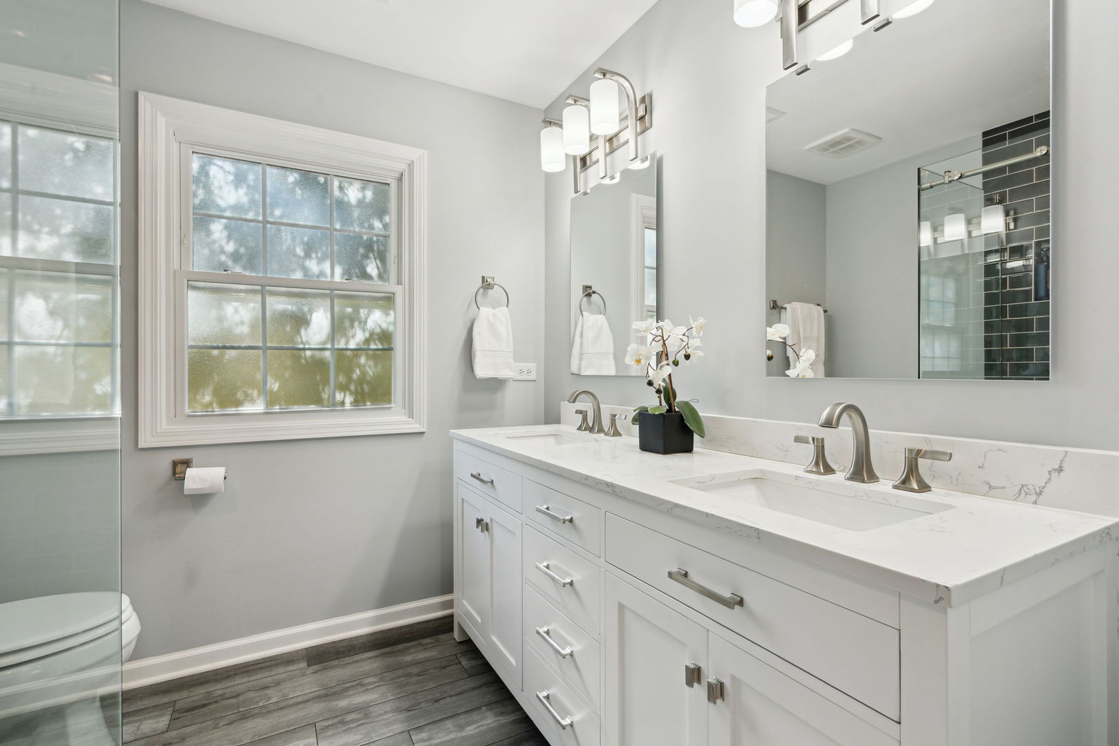 1246 Edward Road Naperville, IL 60540 - Photo 13 of 21 a bathroom with a double vanity sink and a mirror