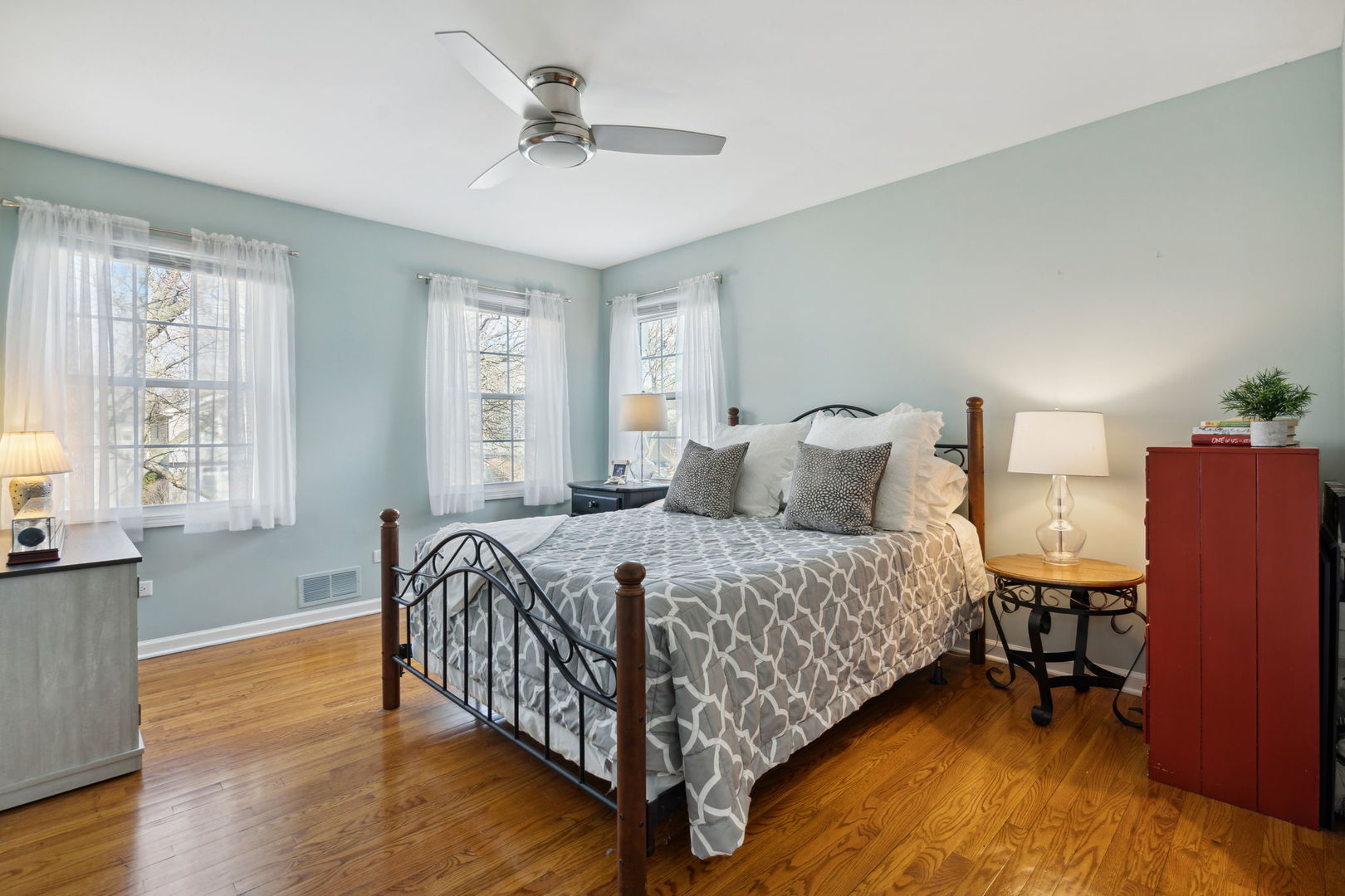 1246 Edward Road Naperville, IL 60540 - Photo 14 of 21 a bedroom with a bed and wooden floor