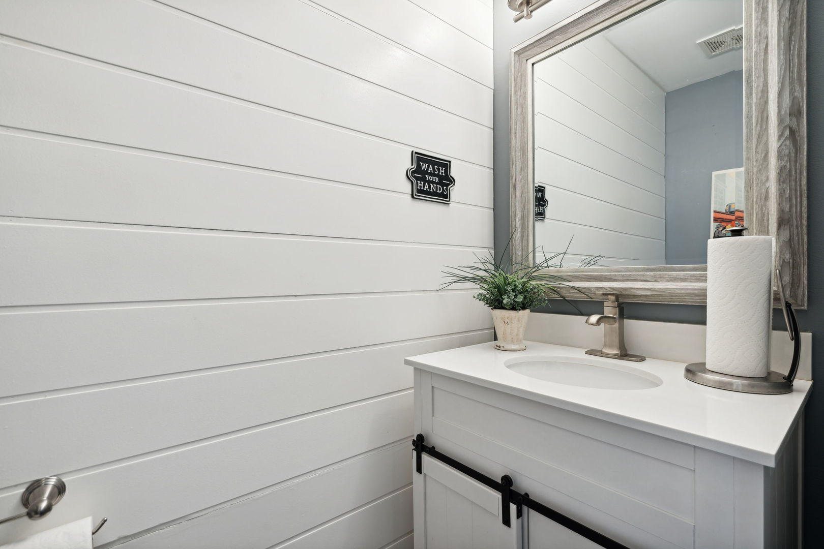 1246 Edward Road Naperville, IL 60540 - Photo 19 of 21 a bathroom with a sink and a mirror