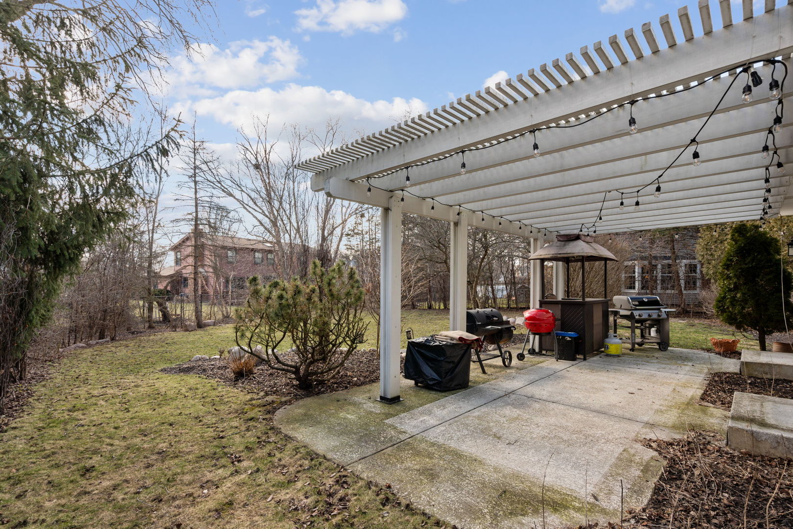 1246 Edward Road Naperville, IL 60540 - Photo 21 of 21 a view of a patio with furniture and a grill