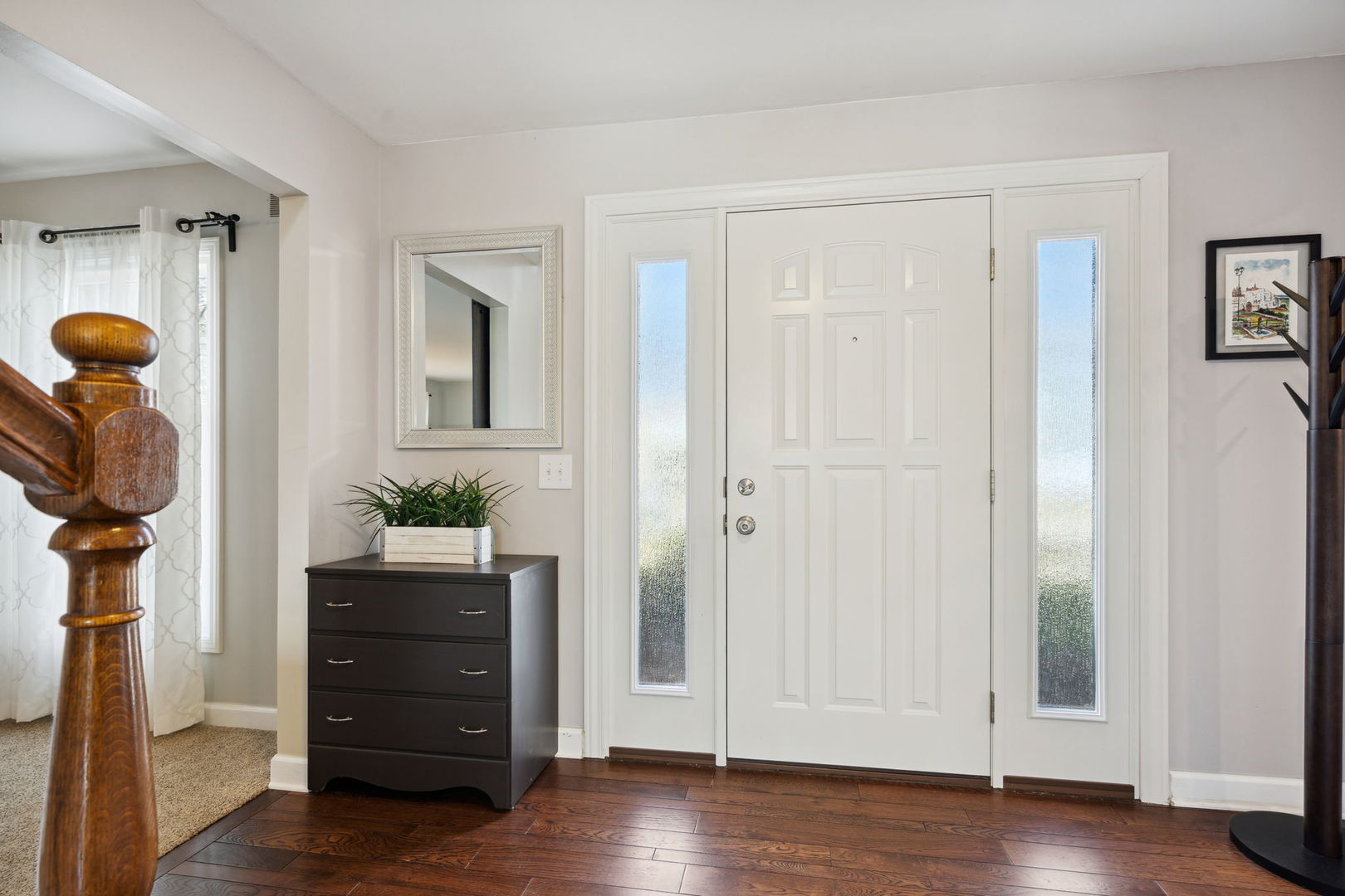1246 Edward Road Naperville, IL 60540 - Photo 3 of 21 a view of a hallway with wooden floor and windows