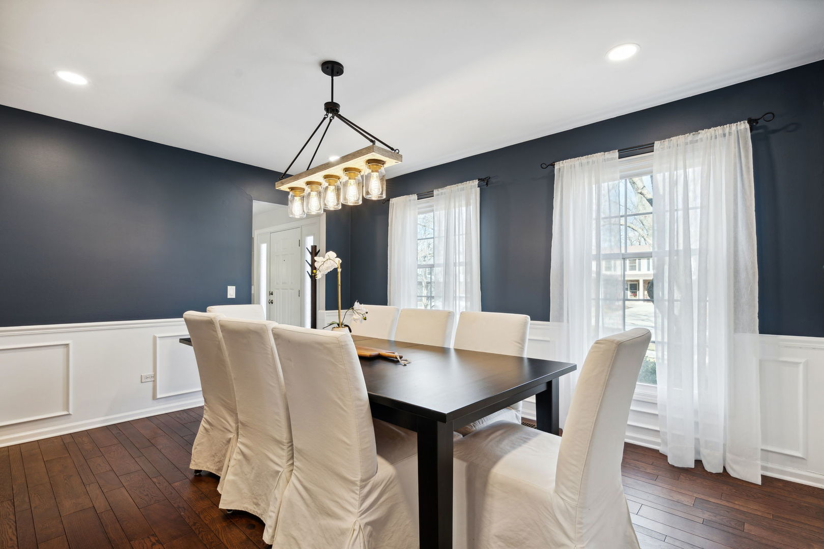 1246 Edward Road Naperville, IL 60540 - Photo 4 of 21 a view of a dining room with furniture window and wooden floor