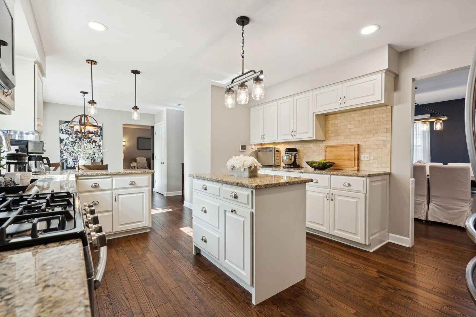 1246 Edward Road Naperville, IL 60540 - Photo 6 of 21 a kitchen with stove refrigerator and cabinets