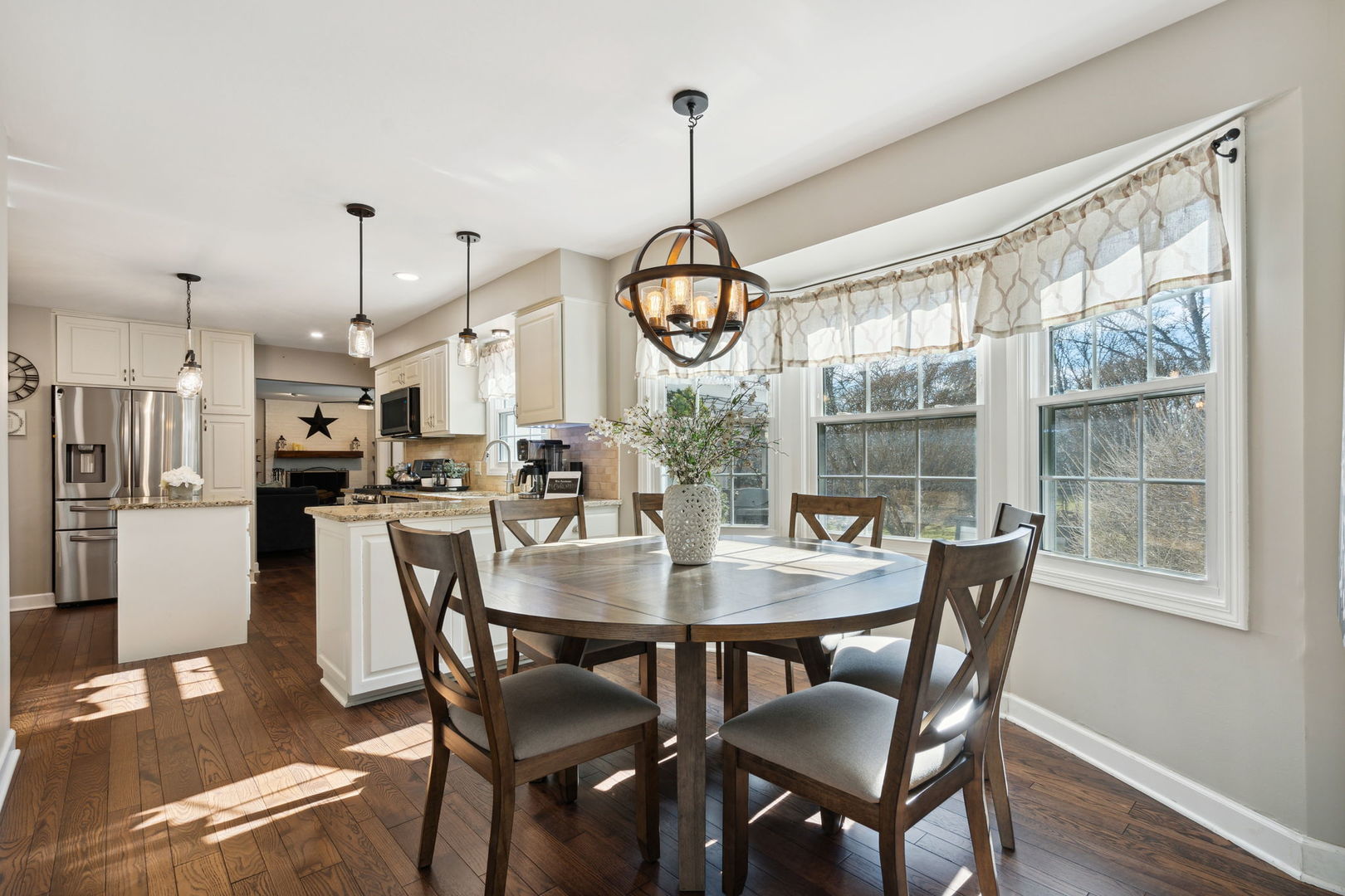 1246 Edward Road Naperville, IL 60540 - Photo 7 of 21 a view of a dining room with furniture window and wooden floor