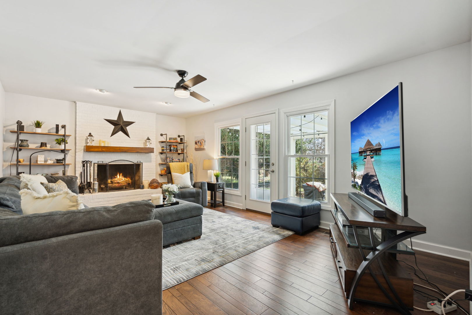 1246 Edward Road Naperville, IL 60540 - Photo 10 of 21 a living room with furniture a fireplace and a large window