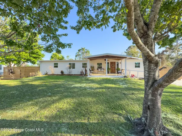 a view of a swimming pool with a yard
