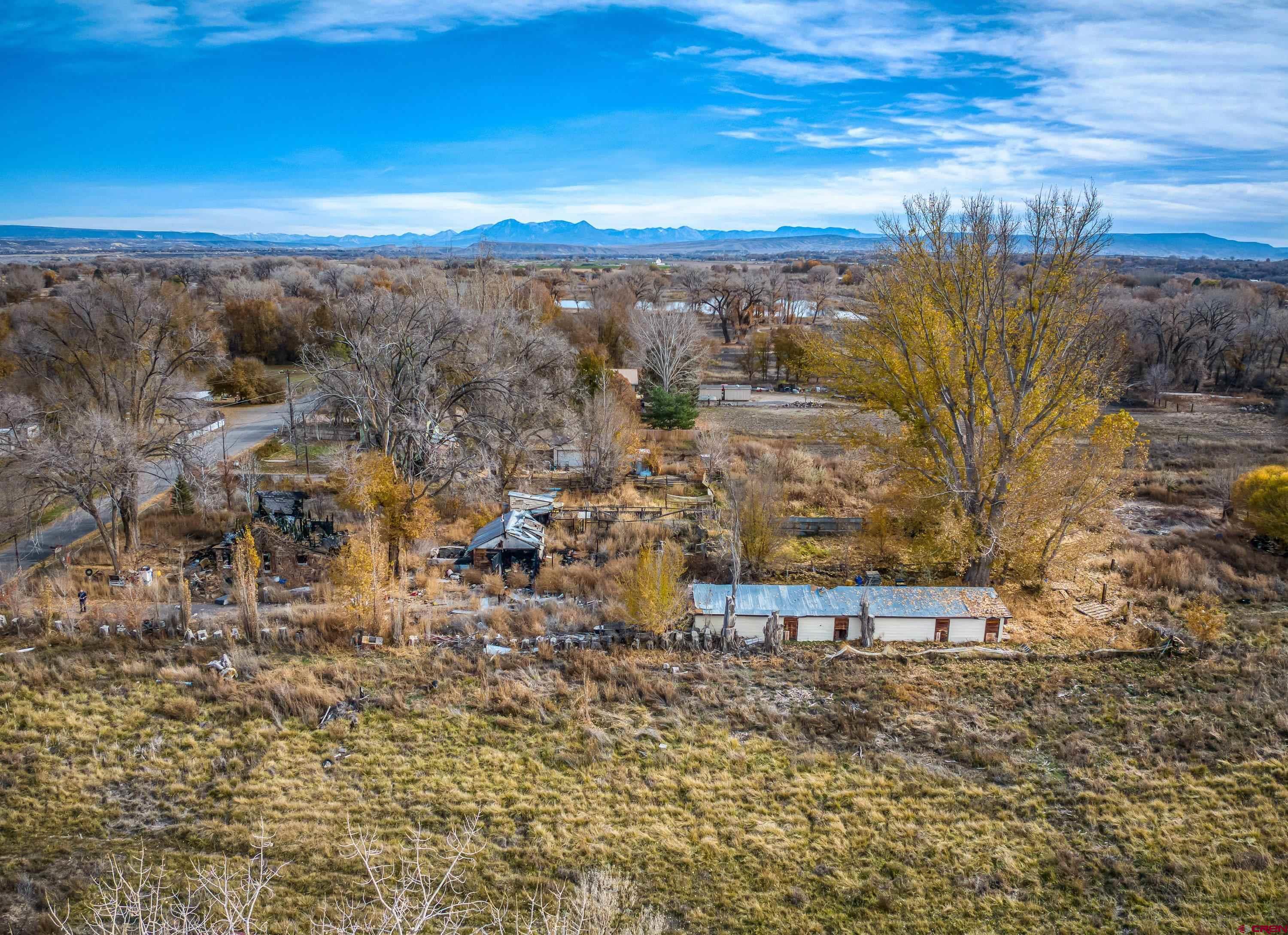 1663 H38 Road Delta, CO 81416 - Photo 6 of 20 a view of a yard with wooden floor and city view