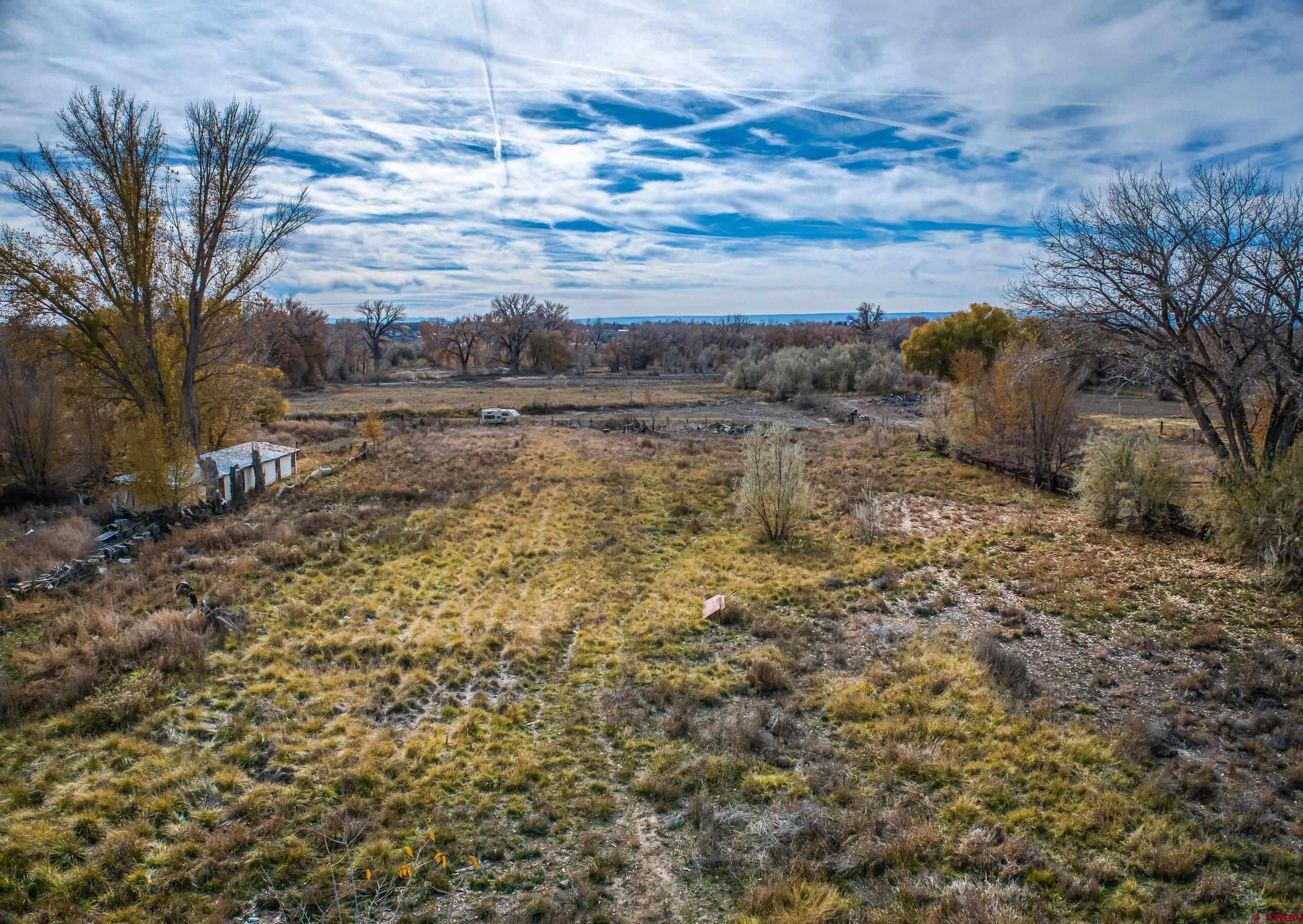 1663 H38 Road Delta, CO 81416 - Photo 9 of 20 a view of a yard with wooden fence