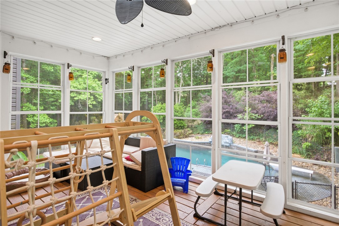 207 Devonhurst Drive Seneca, SC 29678 - Photo 15 of 50 This bright main level sunroom offers expansive views and seamless access to the outdoor pool area.