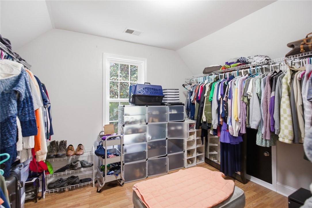 207 Devonhurst Drive Seneca, SC 29678 - Photo 22 of 50 This spacious walk-in closet offers ample storage with convenient shelving and a window for natural light.