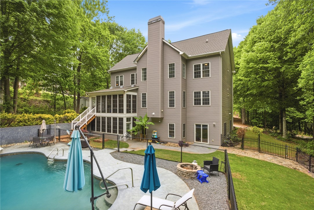 207 Devonhurst Drive Seneca, SC 29678 - Photo 38 of 50 This property offers outdoor living with a private pool and wooded views.