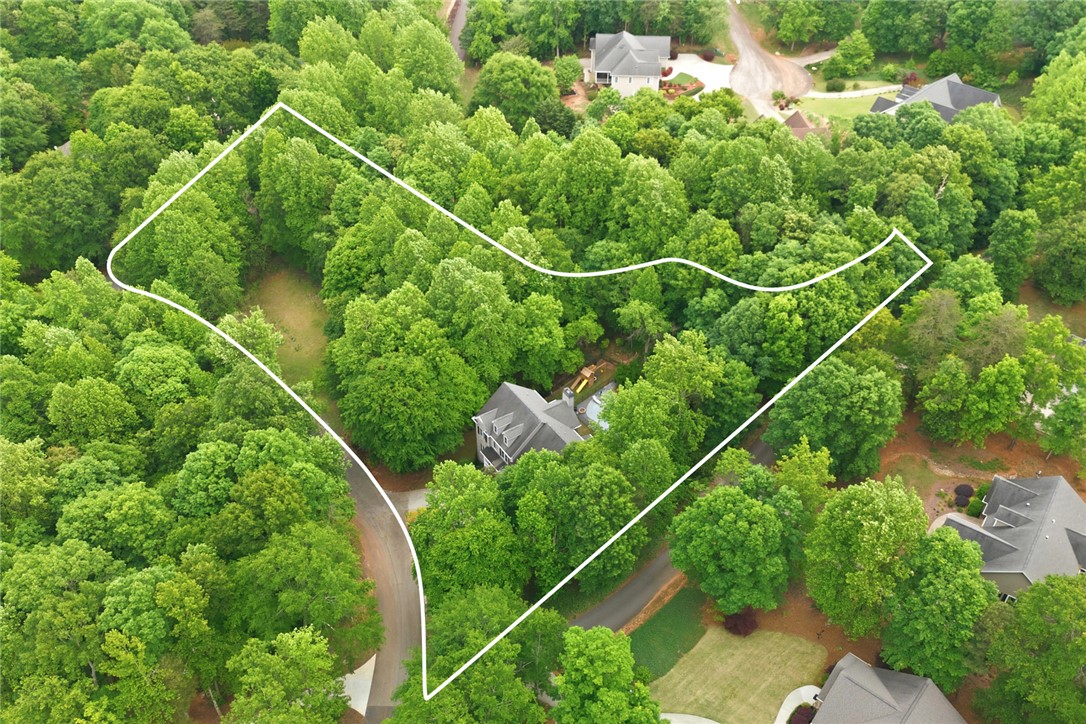 207 Devonhurst Drive Seneca, SC 29678 - Photo 46 of 50 Expansive treed property with an inviting pool, ideal for serene living.