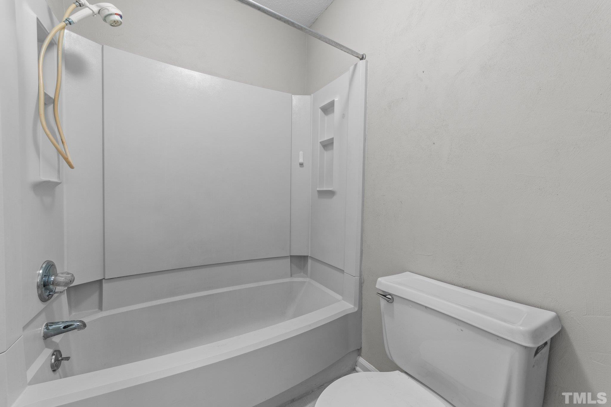 320 Summerfield Crossing Road Chapel Hill, NC 27514 - Photo 11 of 17 a bathroom with a toilet and bathtub