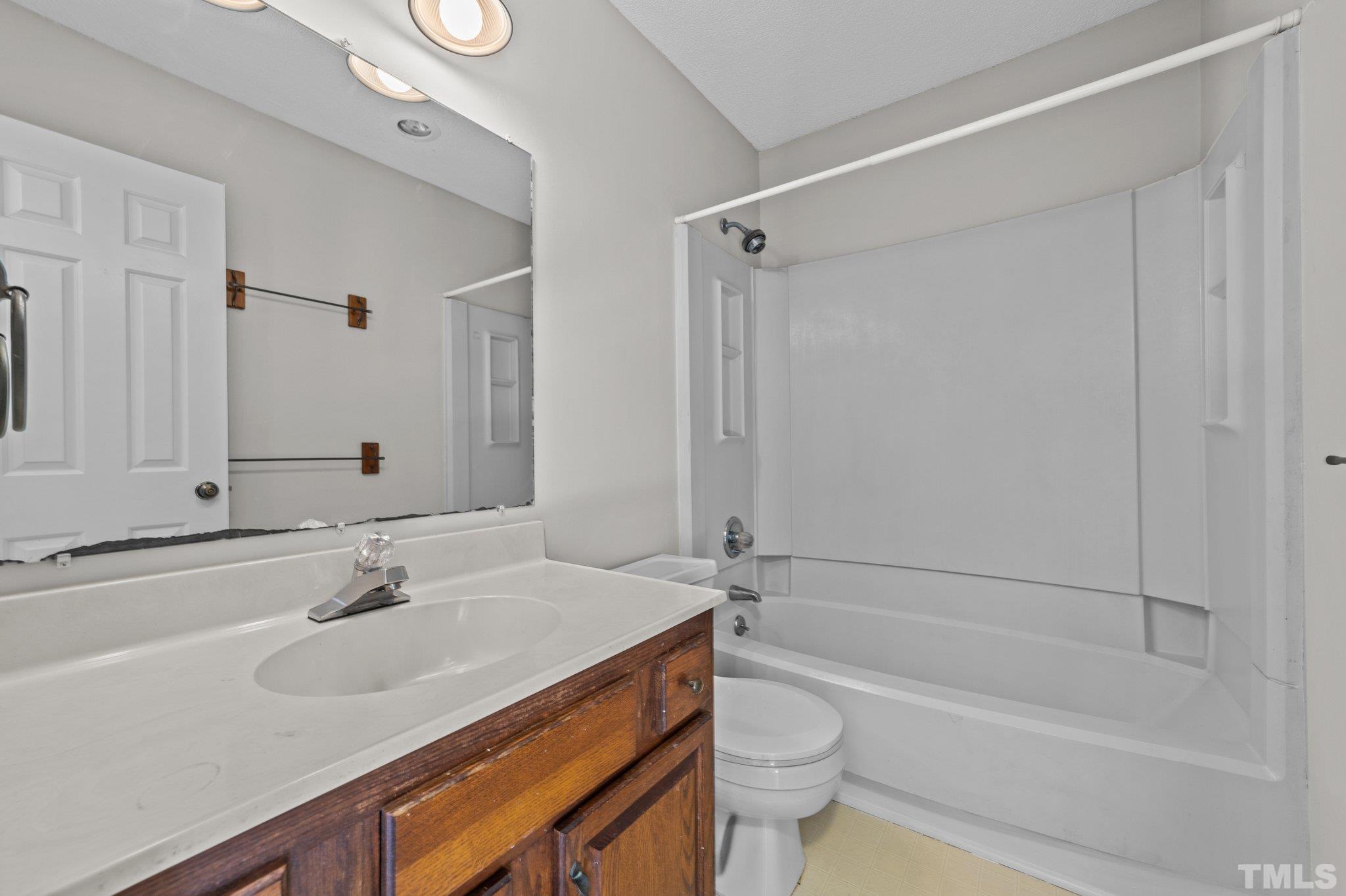 320 Summerfield Crossing Road Chapel Hill, NC 27514 - Photo 14 of 17 a bathroom with a sink a toilet and a bathtub