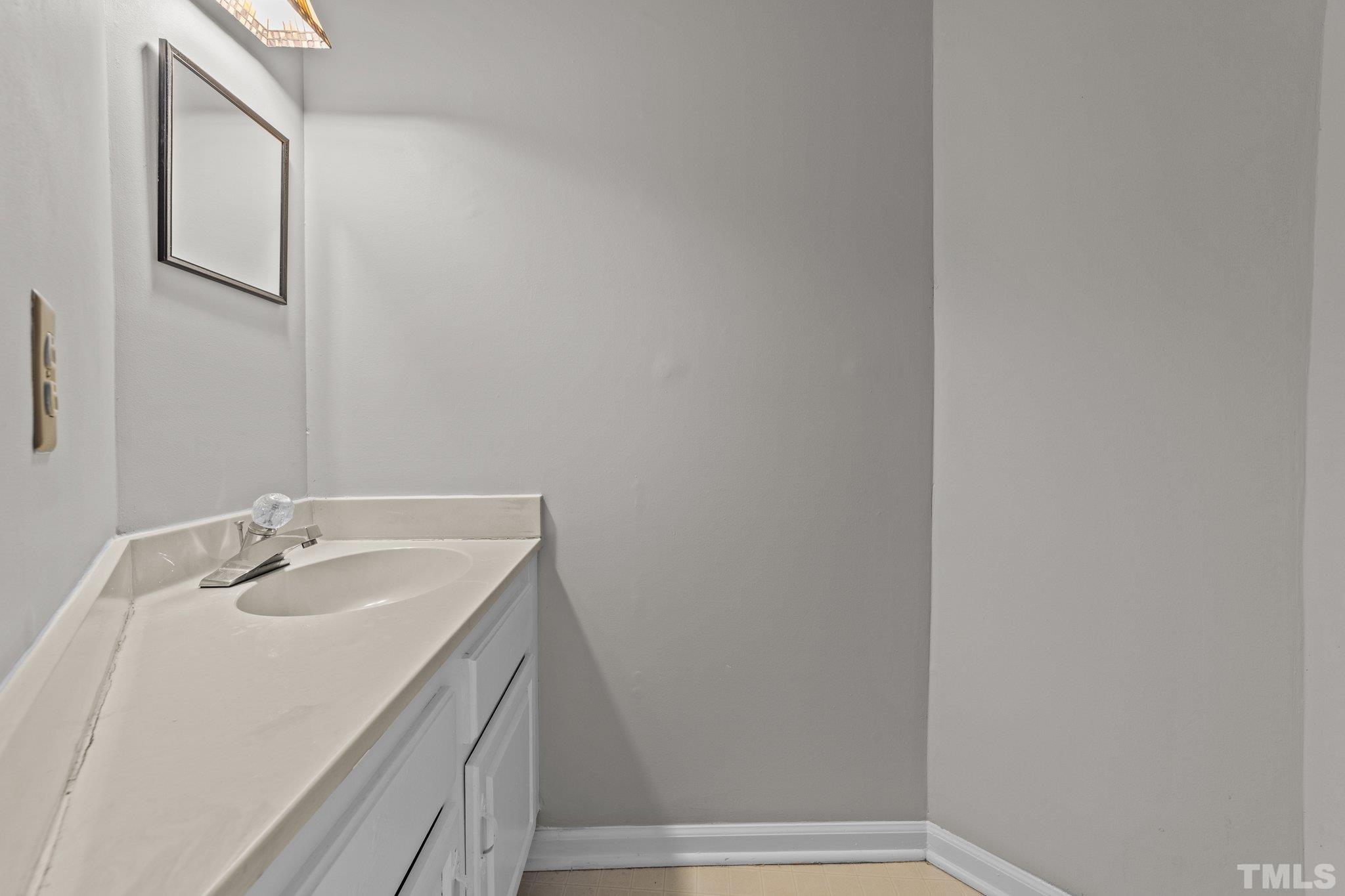 320 Summerfield Crossing Road Chapel Hill, NC 27514 - Photo 8 of 17 a bathroom with a sink and a mirror