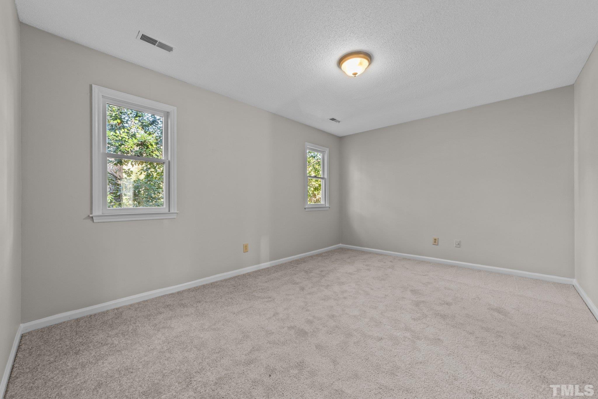 320 Summerfield Crossing Road Chapel Hill, NC 27514 - Photo 9 of 17 a view of an empty room with a window
