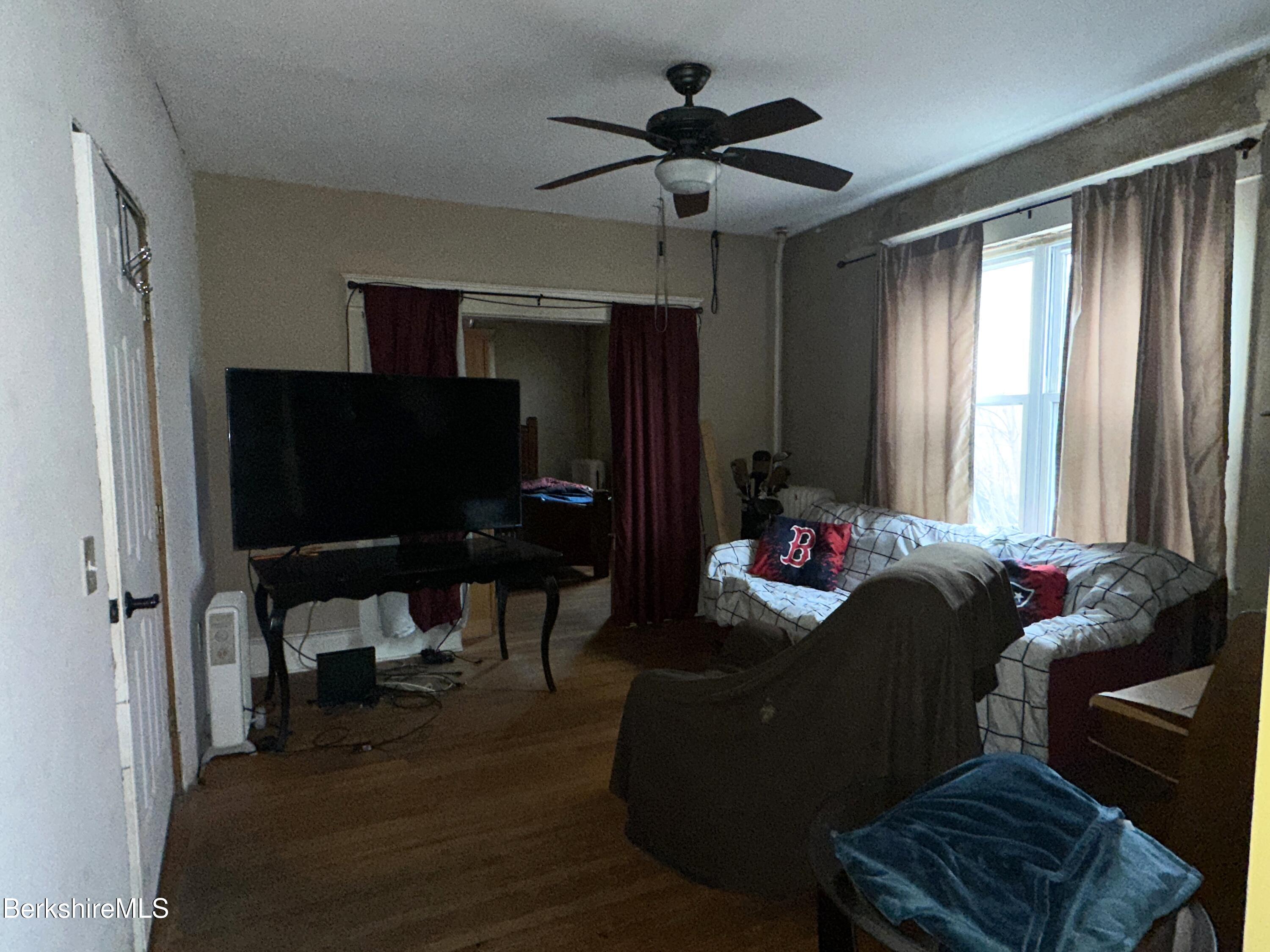 165-167 Appleton Avenue Pittsfield, MA 01201 - Photo 11 of 35 a living room with furniture and a window