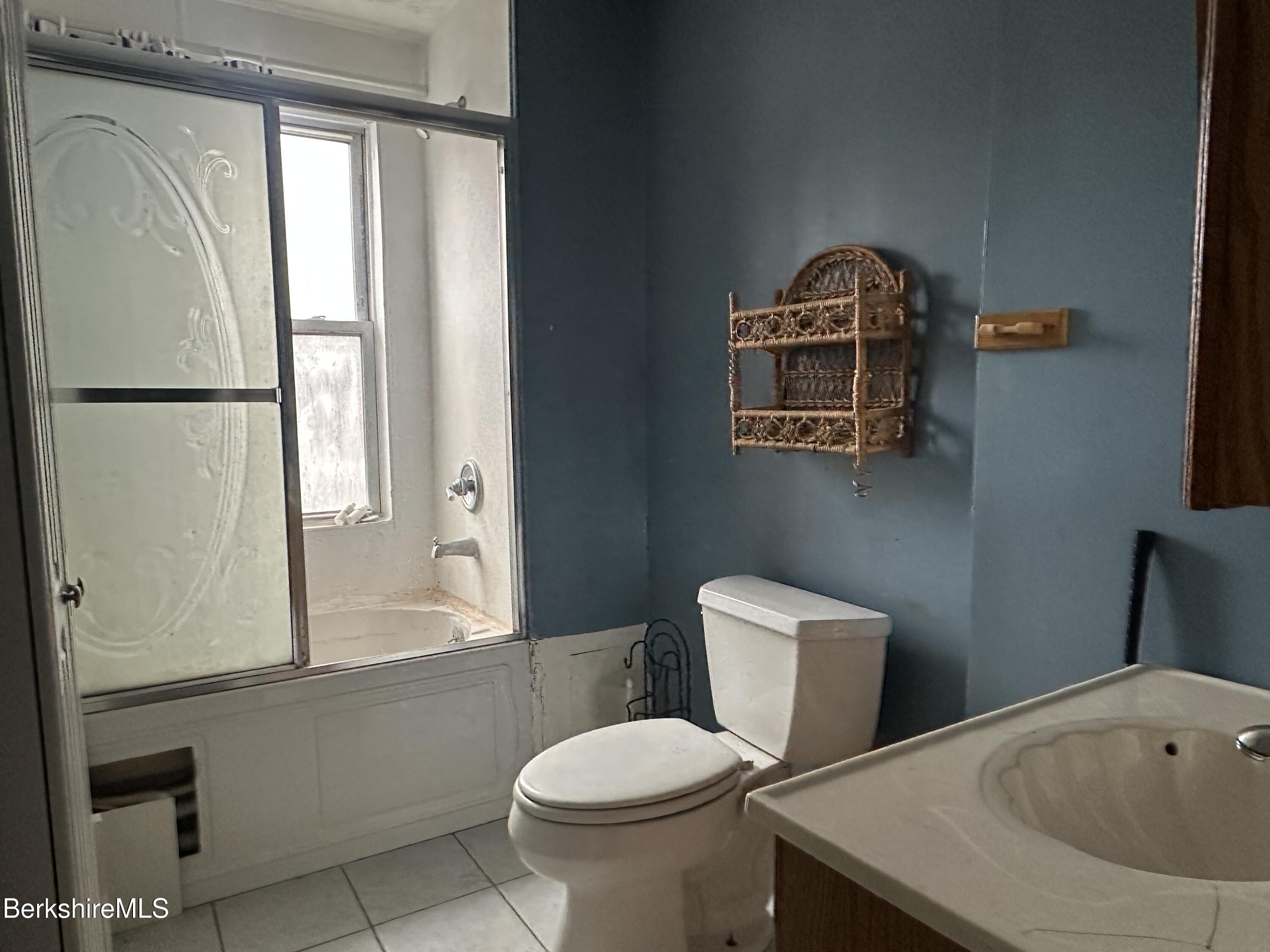 165-167 Appleton Avenue Pittsfield, MA 01201 - Photo 15 of 35 a bathroom with a toilet a sink and a bathtub