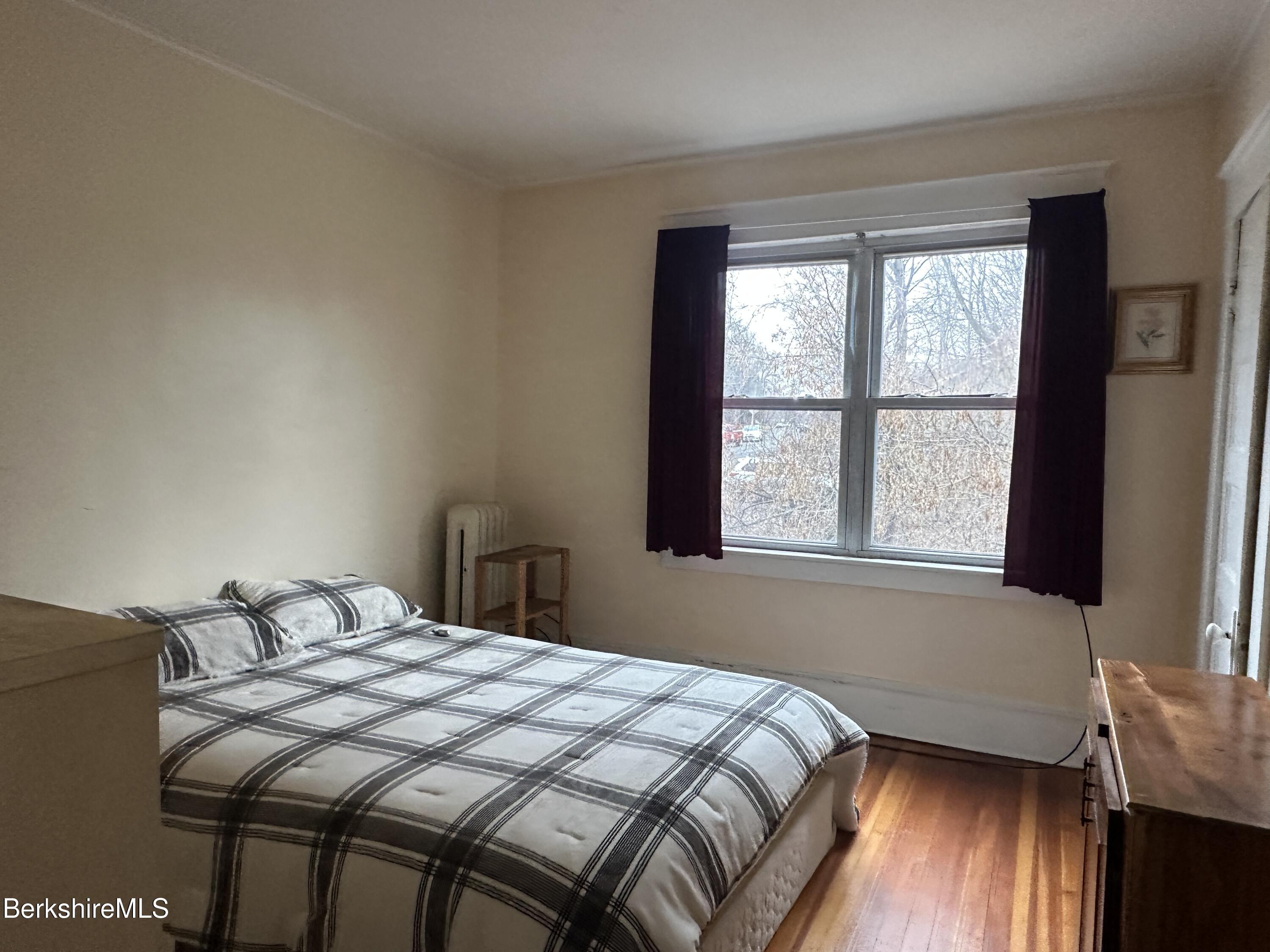 165-167 Appleton Avenue Pittsfield, MA 01201 - Photo 17 of 35 a bedroom with a bed and a window