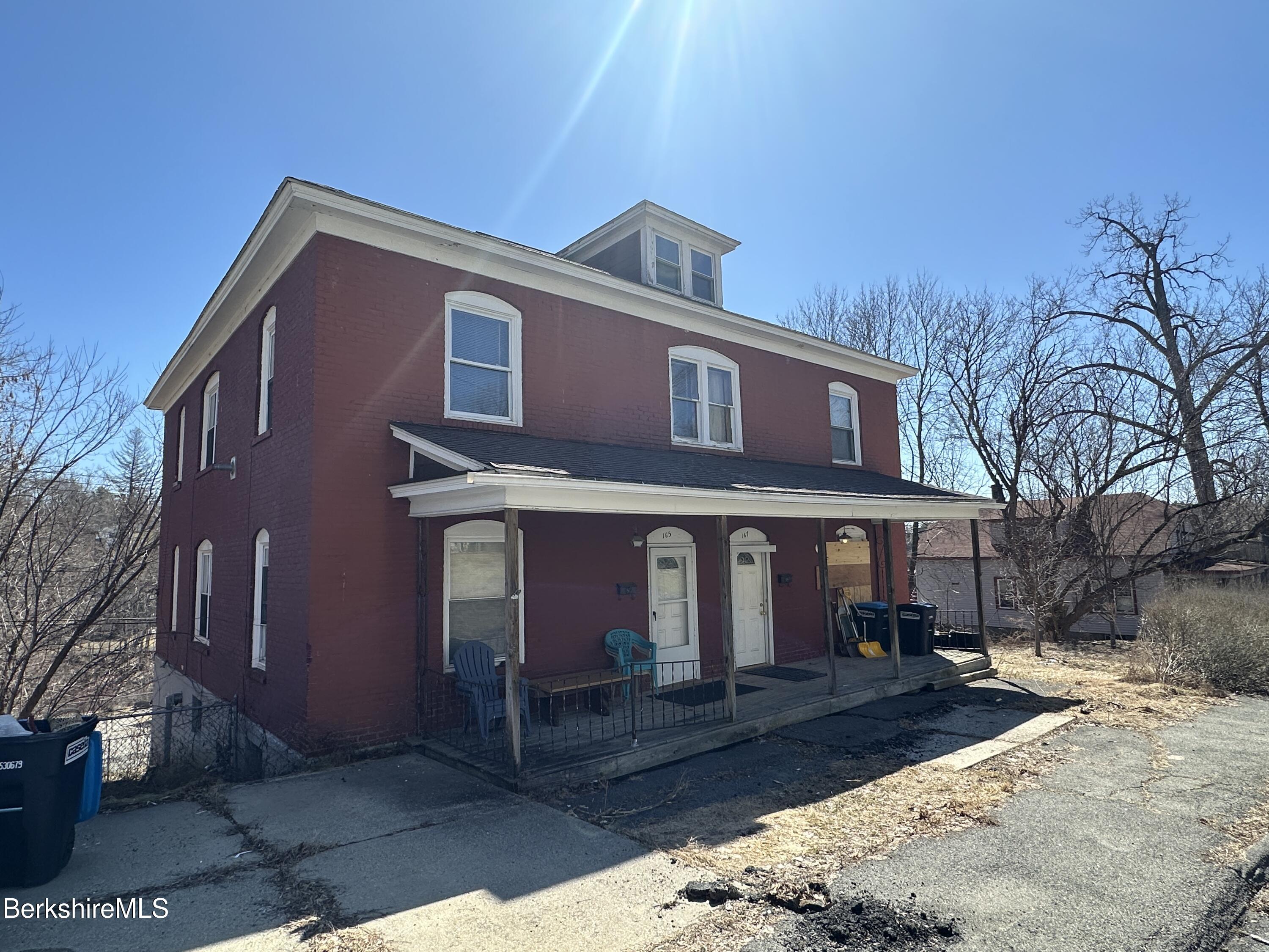 165-167 Appleton Avenue Pittsfield, MA 01201 - Photo 2 of 35 a front view of a house with a yard