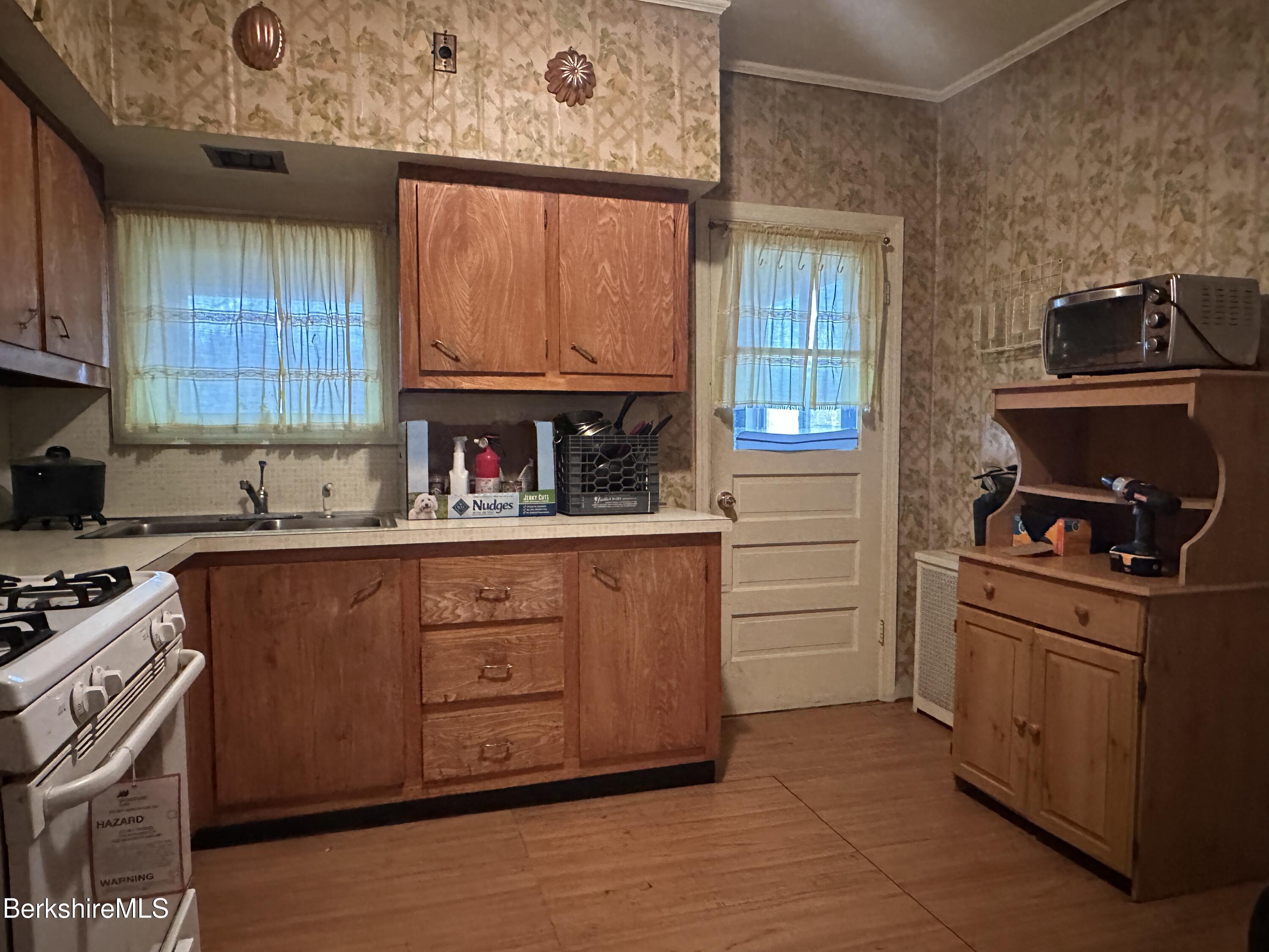165-167 Appleton Avenue Pittsfield, MA 01201 - Photo 22 of 35 a kitchen with stainless steel appliances granite countertop a stove and a refrigerator