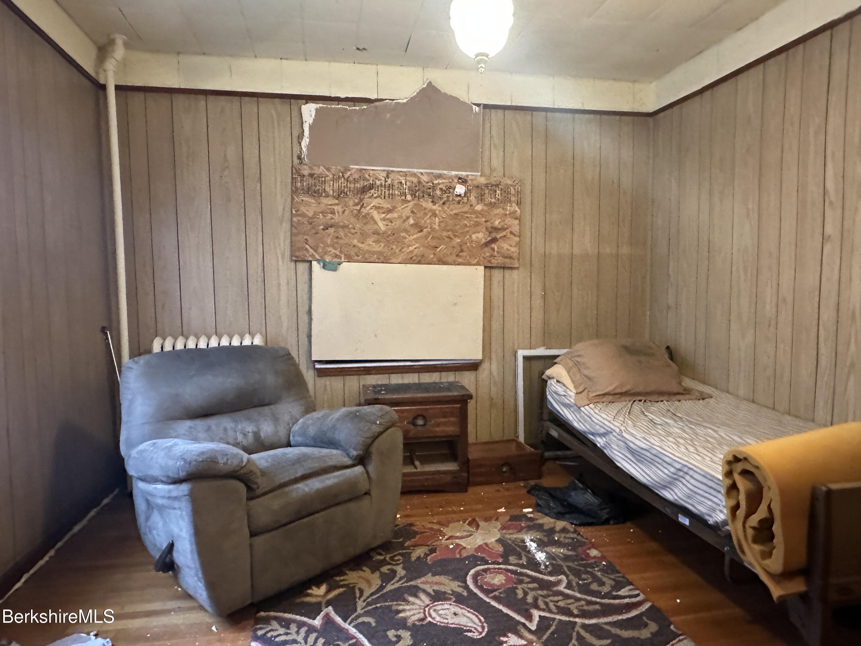 165-167 Appleton Avenue Pittsfield, MA 01201 - Photo 25 of 35 a bedroom with a couch and a dresser