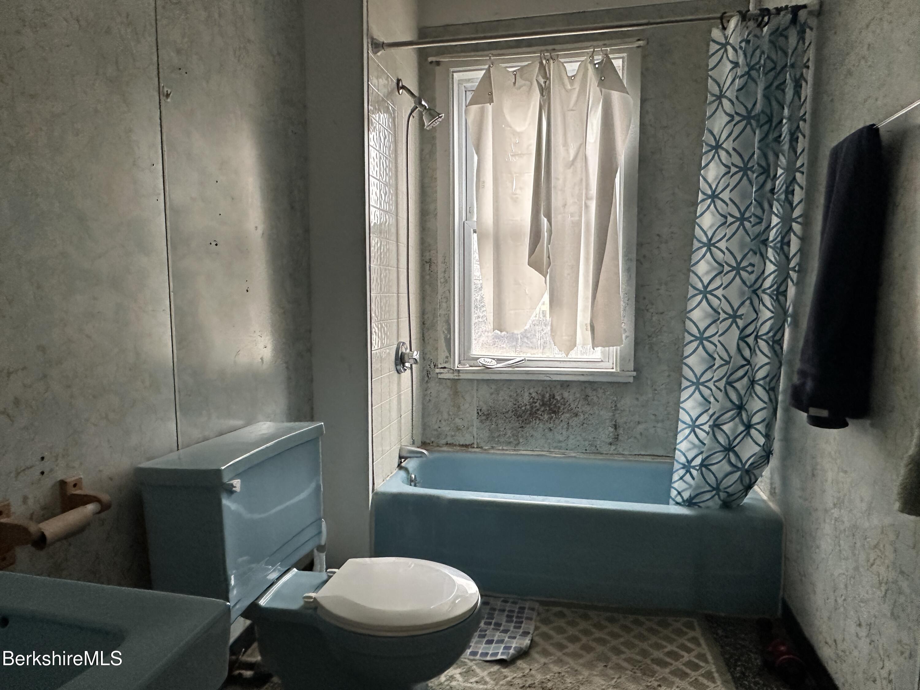 165-167 Appleton Avenue Pittsfield, MA 01201 - Photo 29 of 35 a bathroom with a sink a toilet a window and tub