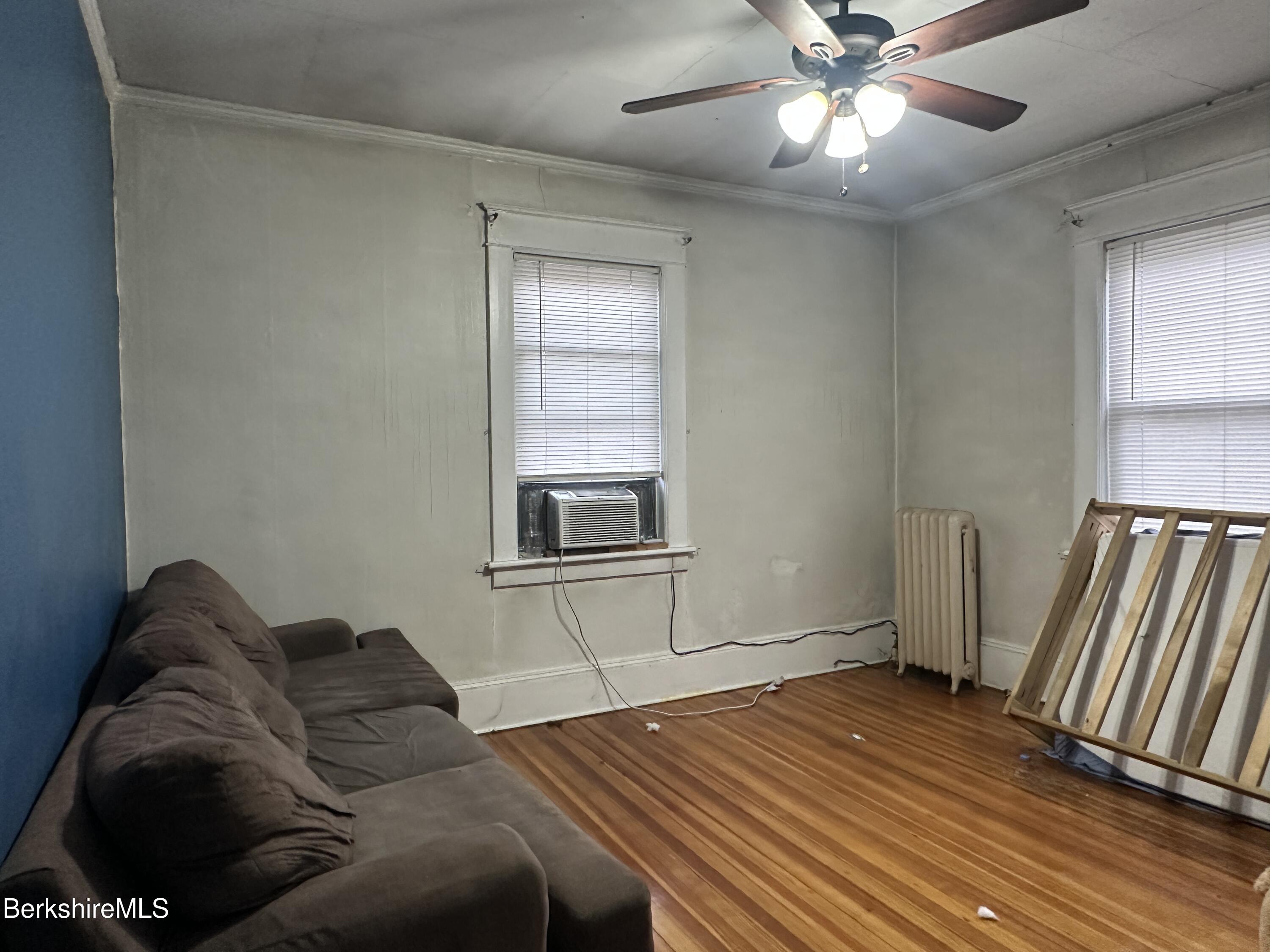 165-167 Appleton Avenue Pittsfield, MA 01201 - Photo 34 of 35 a bedroom with a bed and wooden floor