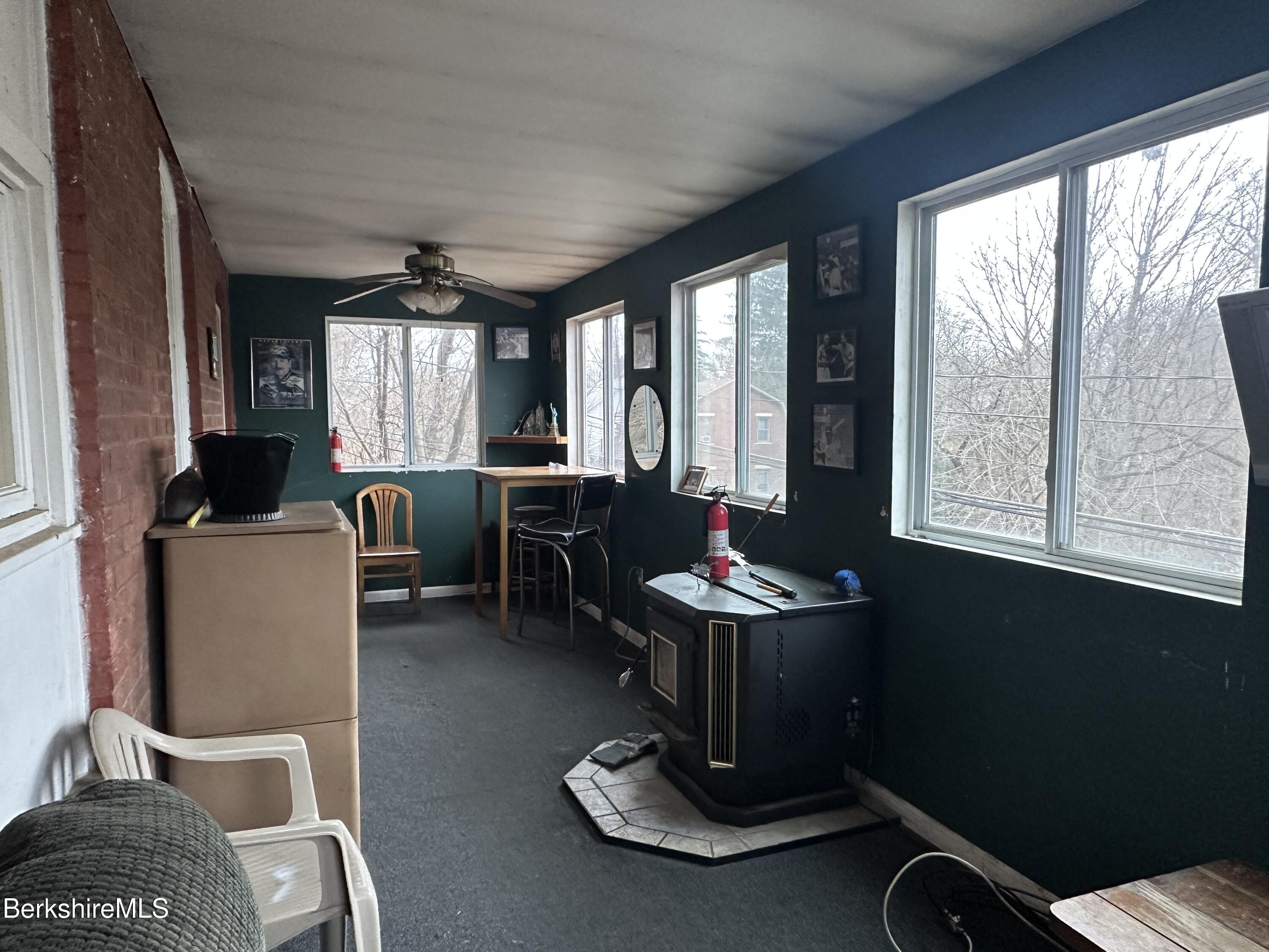 165-167 Appleton Avenue Pittsfield, MA 01201 - Photo 35 of 35 a living room with furniture a flat screen tv and windows