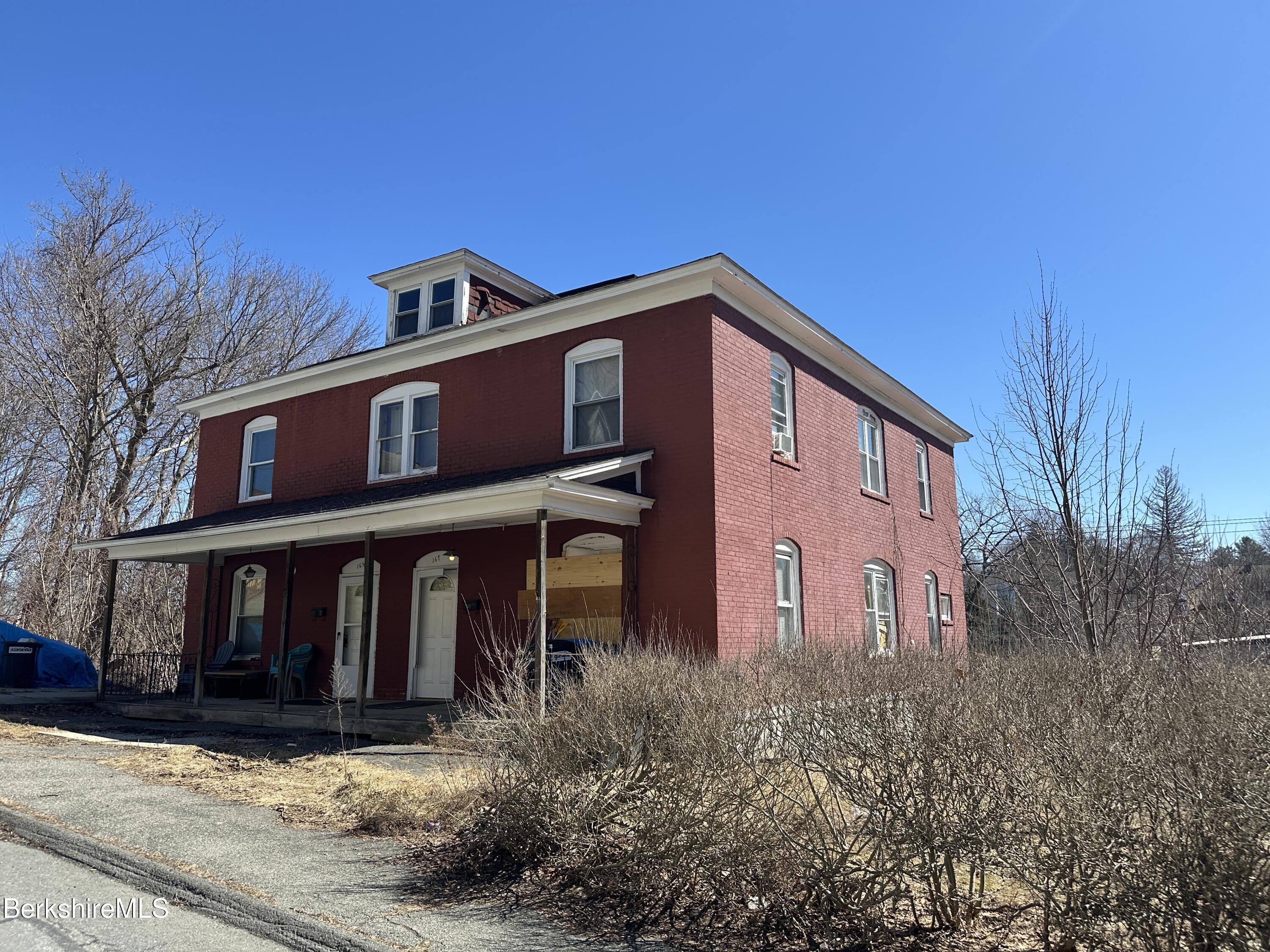 165-167 Appleton Avenue Pittsfield, MA 01201 - Photo 4 of 35 a front view of a house with garden