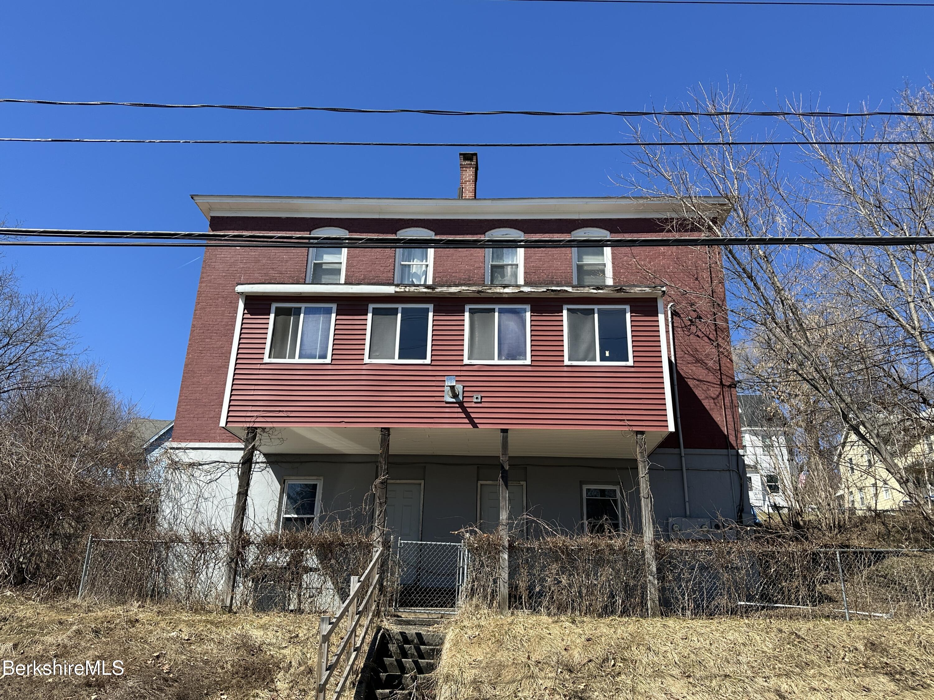165-167 Appleton Avenue Pittsfield, MA 01201 - Photo 6 of 35 a front view of a house with a yard