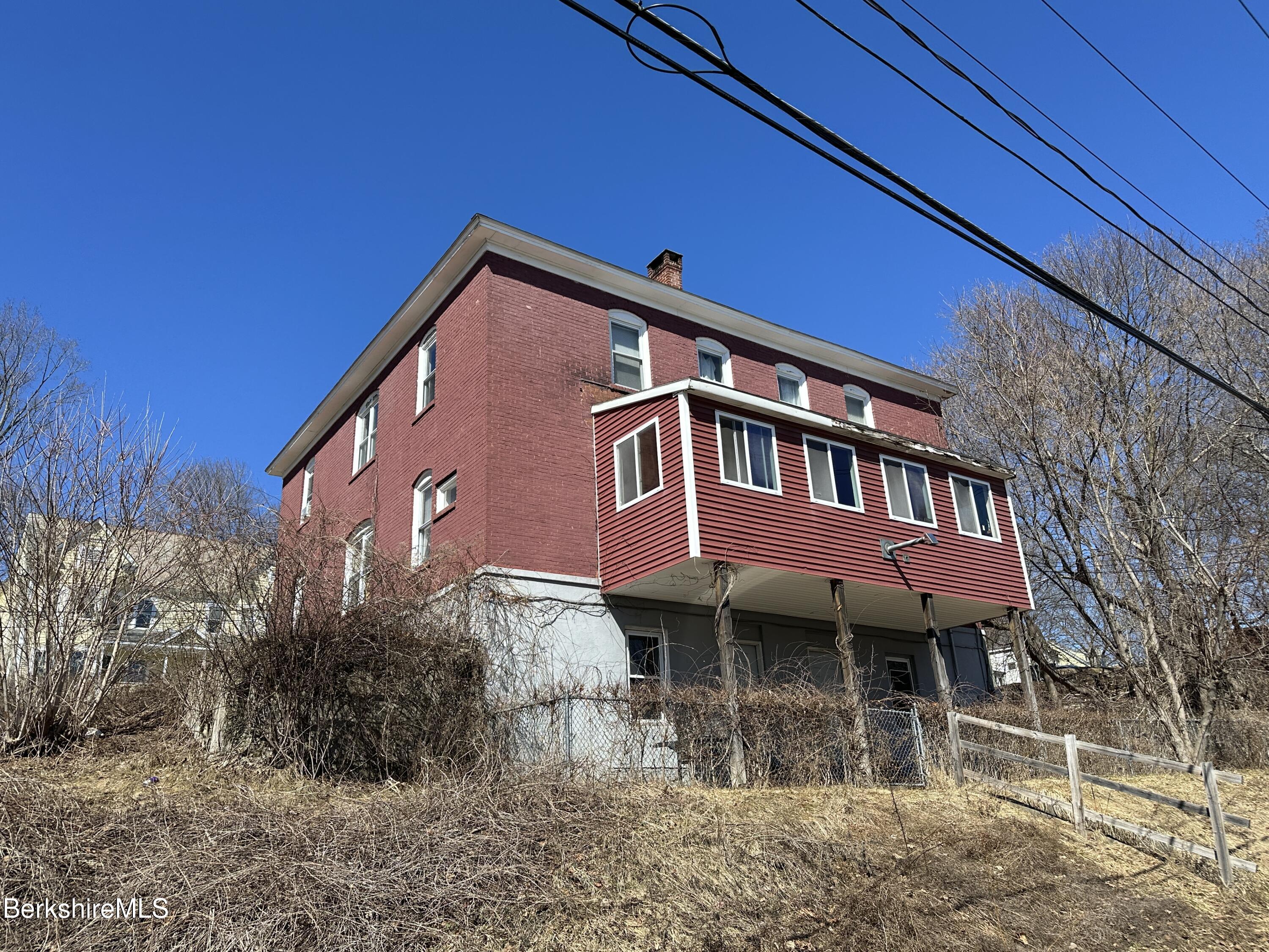 165-167 Appleton Avenue Pittsfield, MA 01201 - Photo 8 of 35 a front view of a house with yard