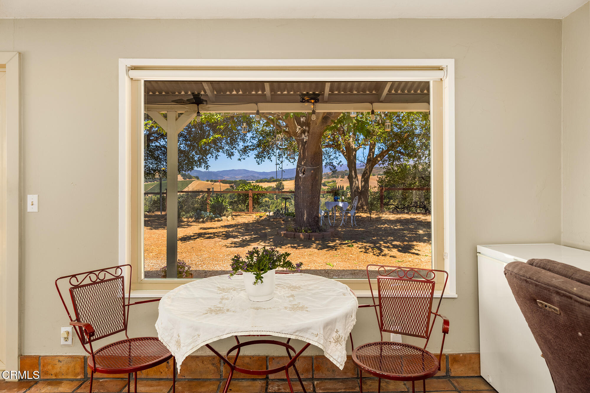 45 Rio Via Oak View, CA 93022 - Photo 17 of 34 a view of a dining room with furniture large windows and wooden floor