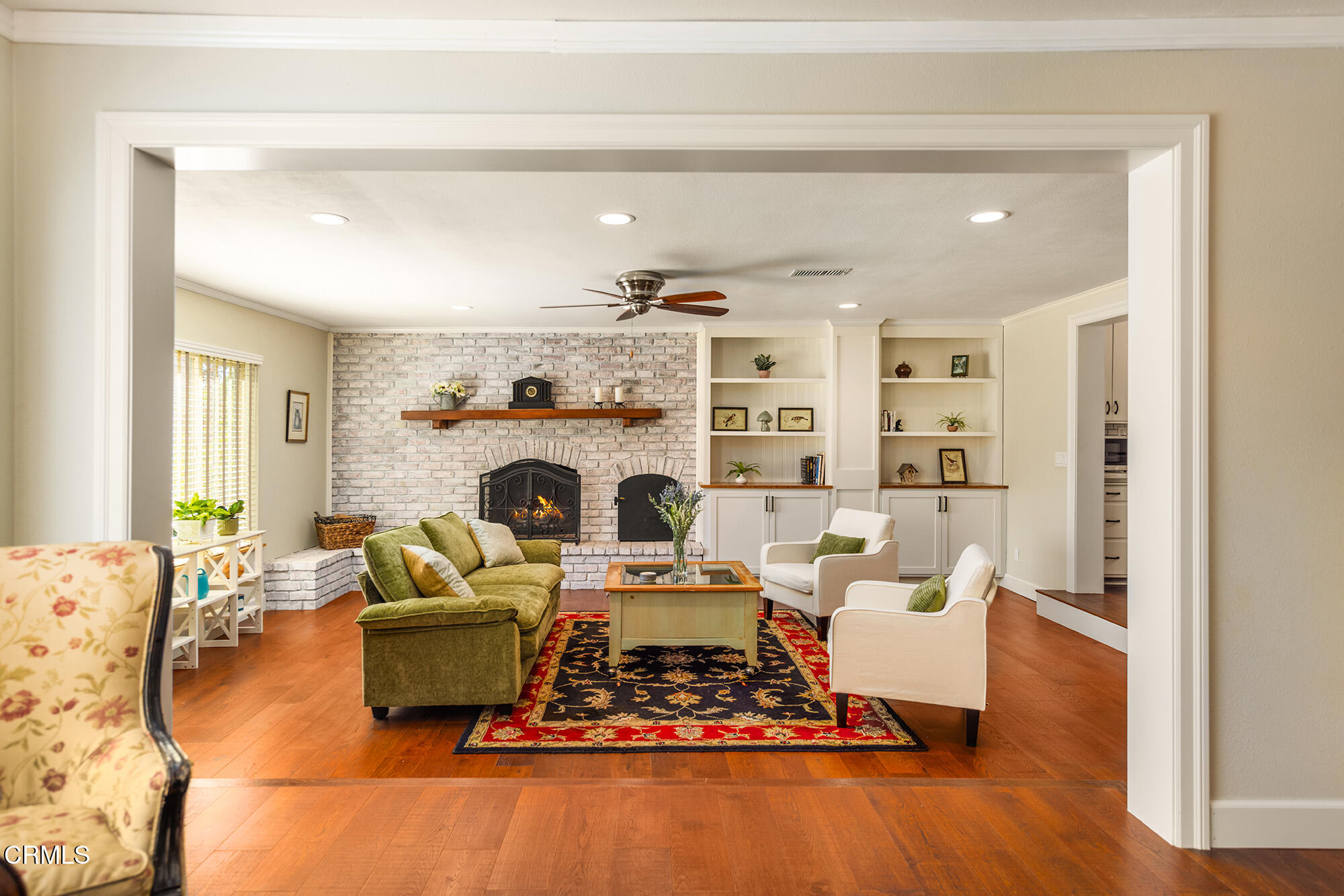 45 Rio Via Oak View, CA 93022 - Photo 7 of 34 a living room with furniture a fireplace and a table
