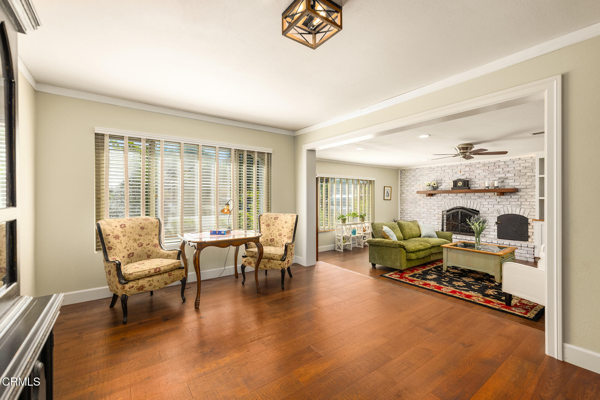 45 Rio Via Oak View, CA 93022 - Photo 9 of 34 a living room with furniture and a table with wooden floor