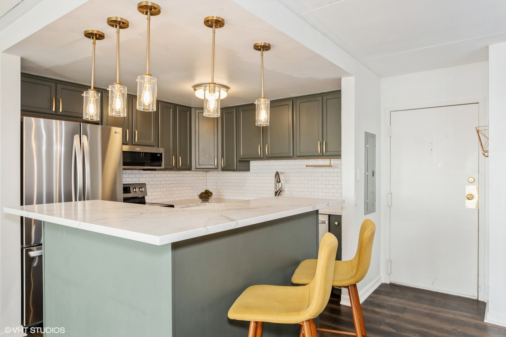 2015 South Finley Road, Unit 403 Lombard, IL 60148 - Photo 3 of 19 a view of kitchen island and wooden cabinets