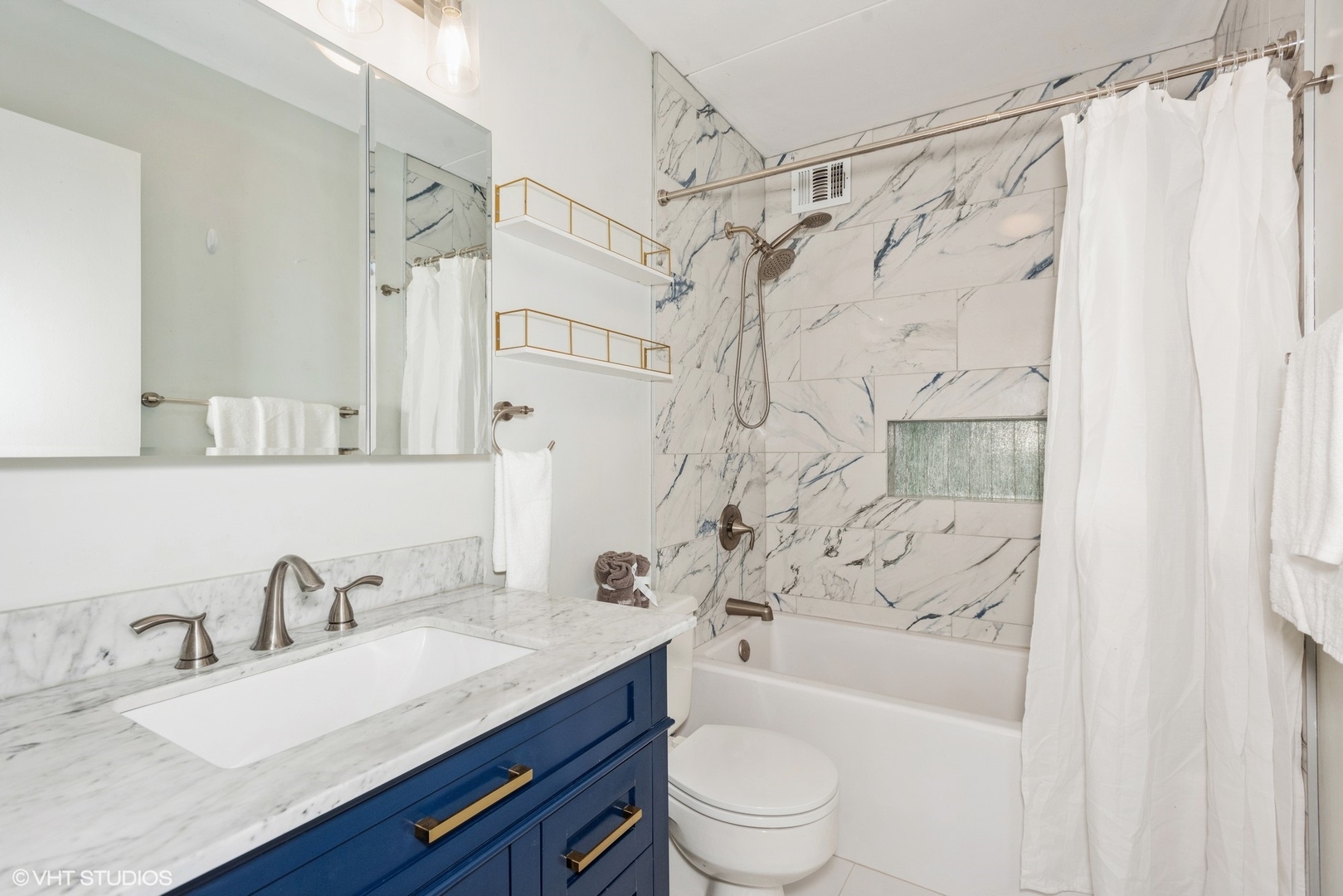 2015 South Finley Road, Unit 403 Lombard, IL 60148 - Photo 6 of 19 a bathroom with a granite countertop sink a toilet and a bathtub