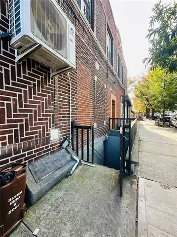a view of a patio with a table and chairs