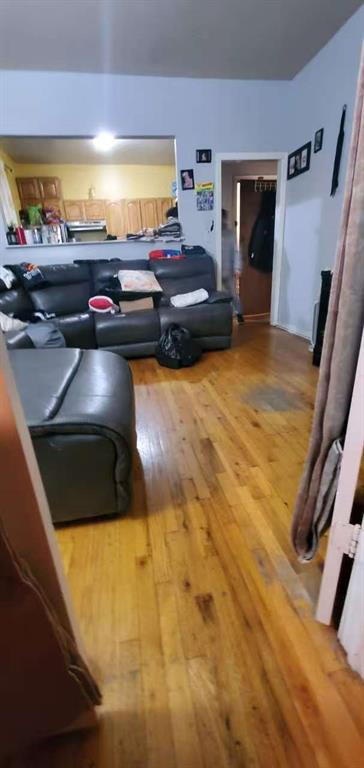 74 Quentin Road Brooklyn, NY 11223 - Photo 7 of 9 a room with furniture and screen