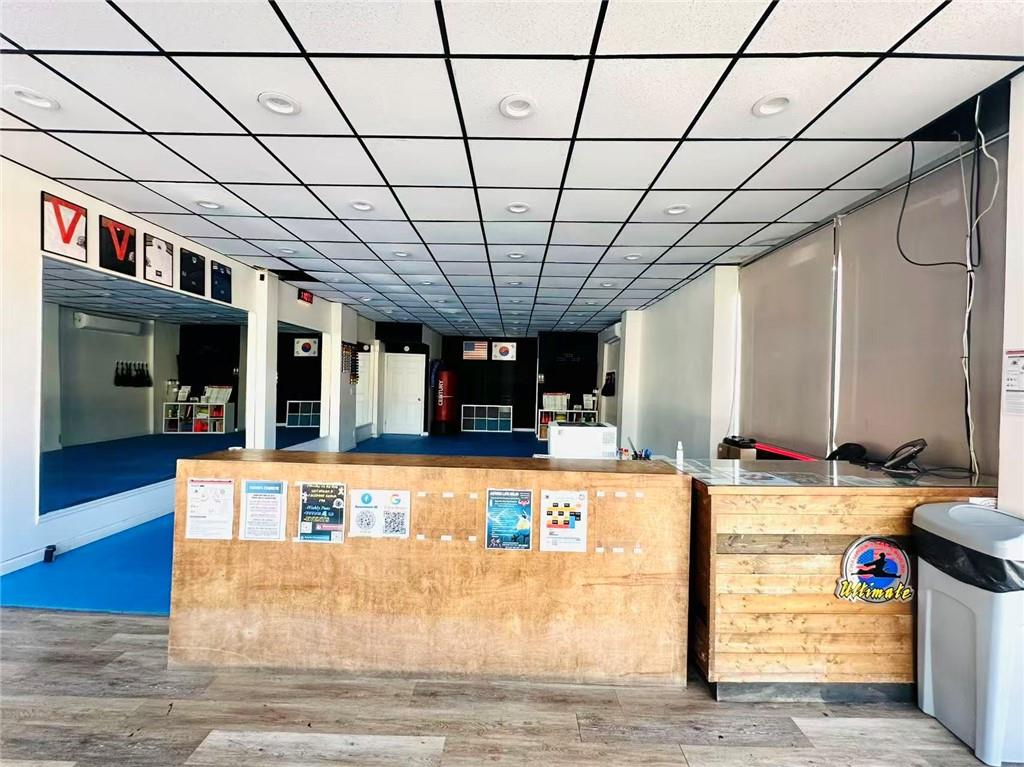 74 Quentin Road Brooklyn, NY 11223 - Photo 9 of 9 a view of a kitchen with kitchen island stainless steel appliances wooden floor and chandelier