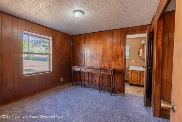 a view of room with furniture and windows