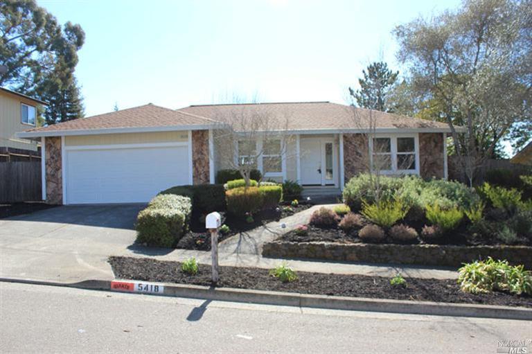 5418 Yerba Buena Road Santa Rosa, CA 95409 - Photo 1 of 1 a front view of a house with a yard and a garage