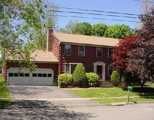125 Valley View Road Stratford, CT 06614 - Photo 1 of 1 a front view of a house with a yard and potted plants